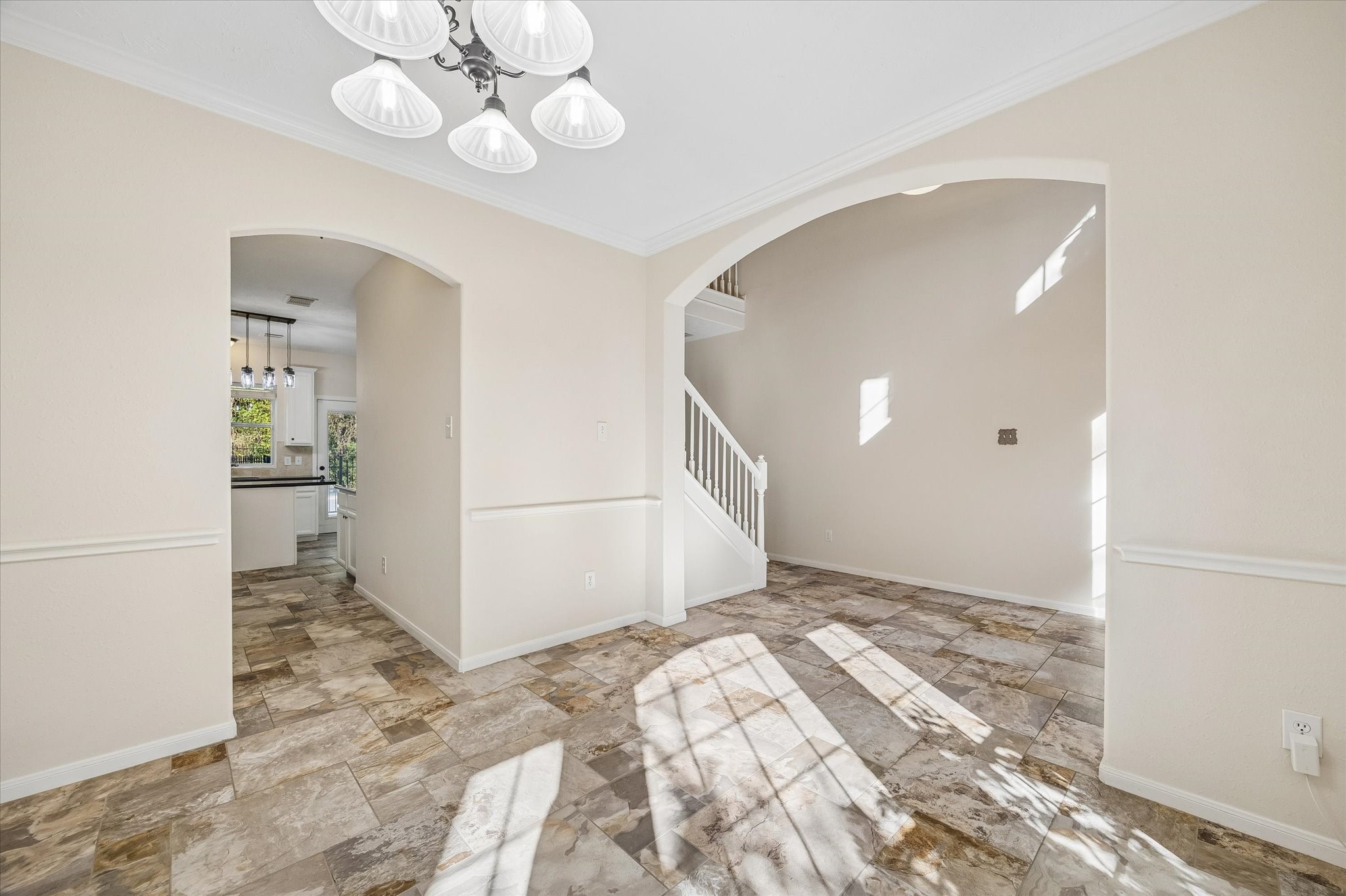 Another view of the formal dining area highlights the seamless flow between the homes living spaces.