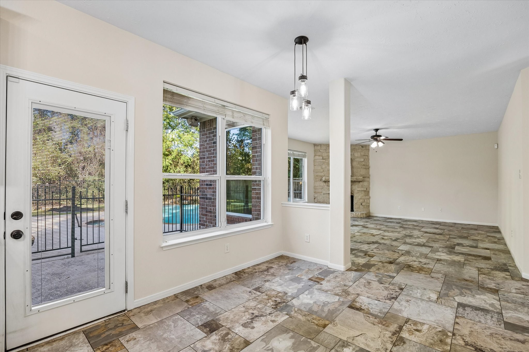 The breakfast area is conveniently located just off the kitchen, with large windows overlooking the backyard and pool!