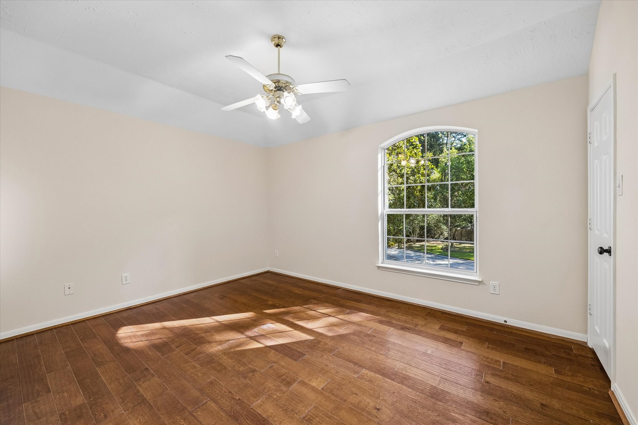 One of the three secondary bedrooms upstairs, featuring a walk-in closet and abundant natural light!