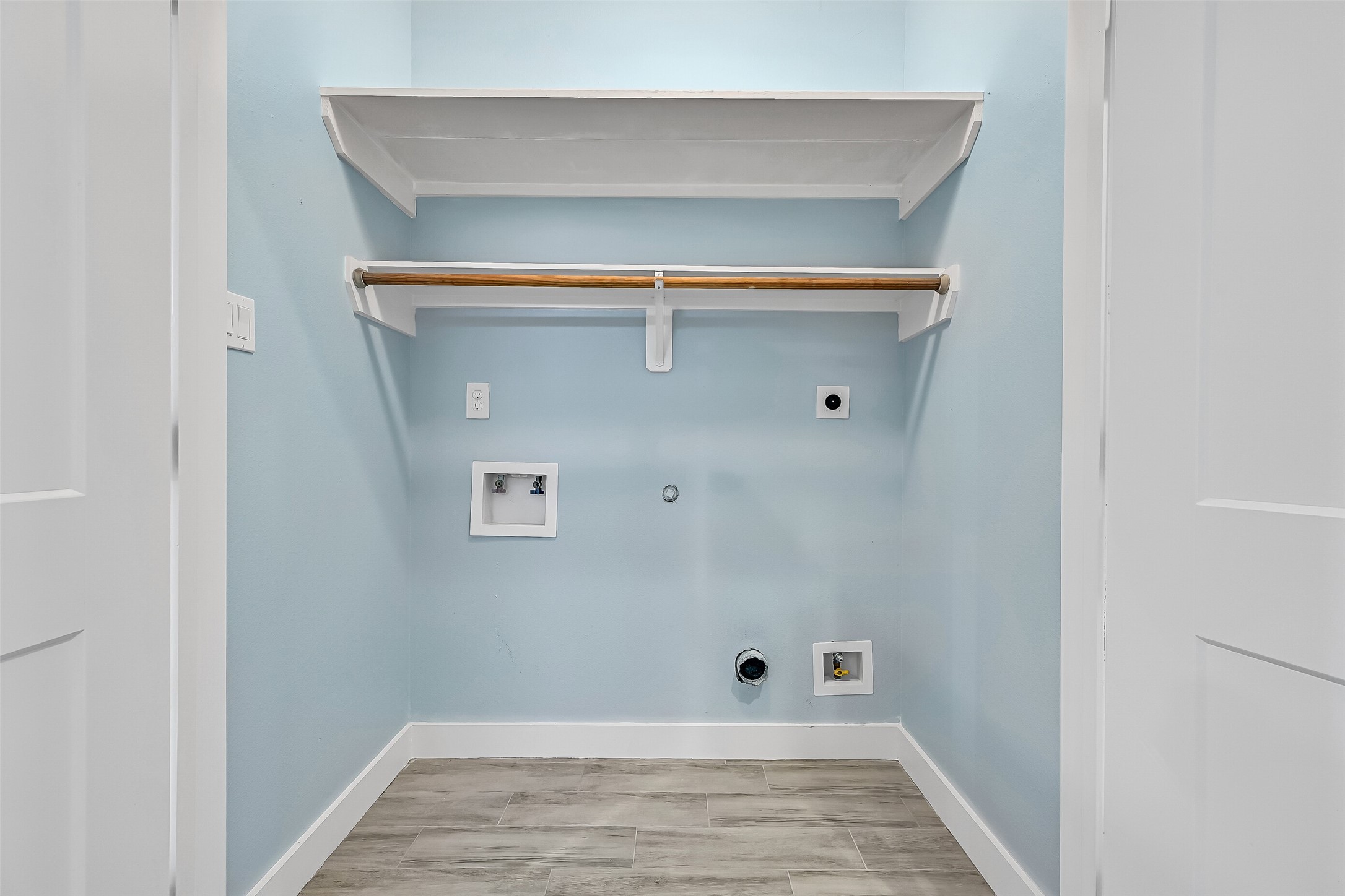 Conveniently located in the hall next to all of the bedrooms is the utility room.