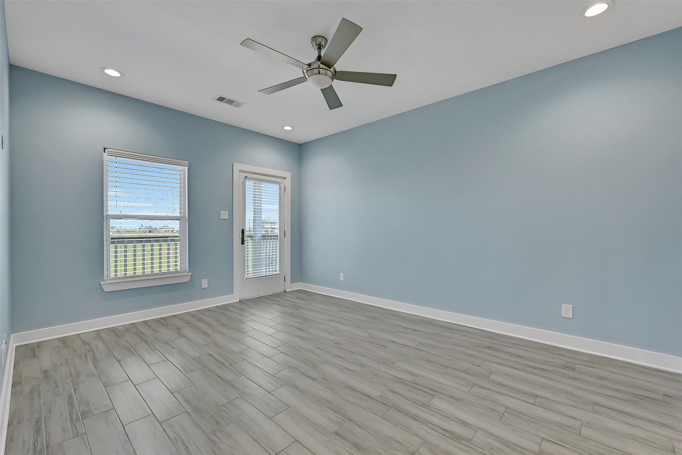 The primary retreat offers a spacious closet, en-suite bathroom and private deck access.