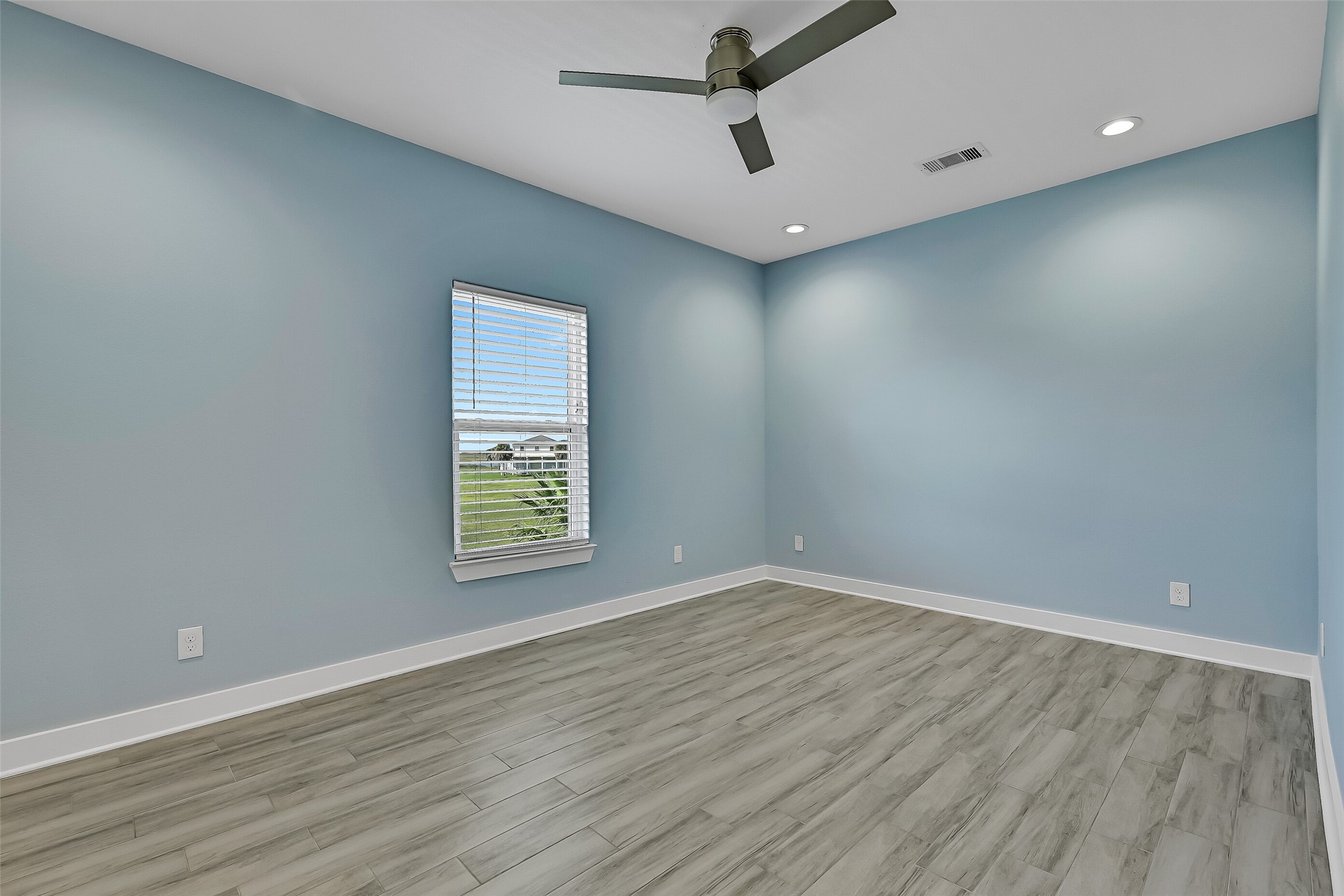 The first guest bedroom offers a spacious closet.