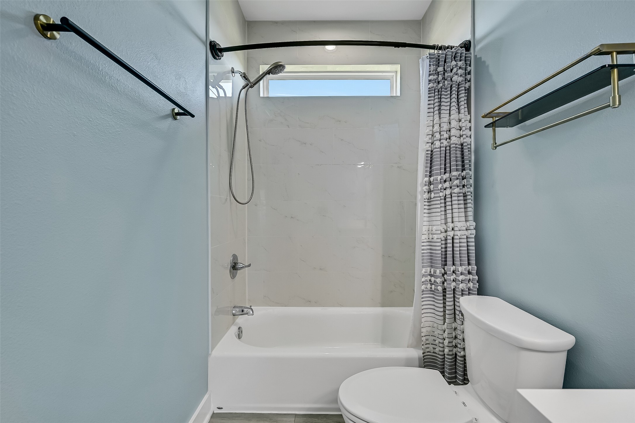 The bathroom offers a tub/shower combo.
