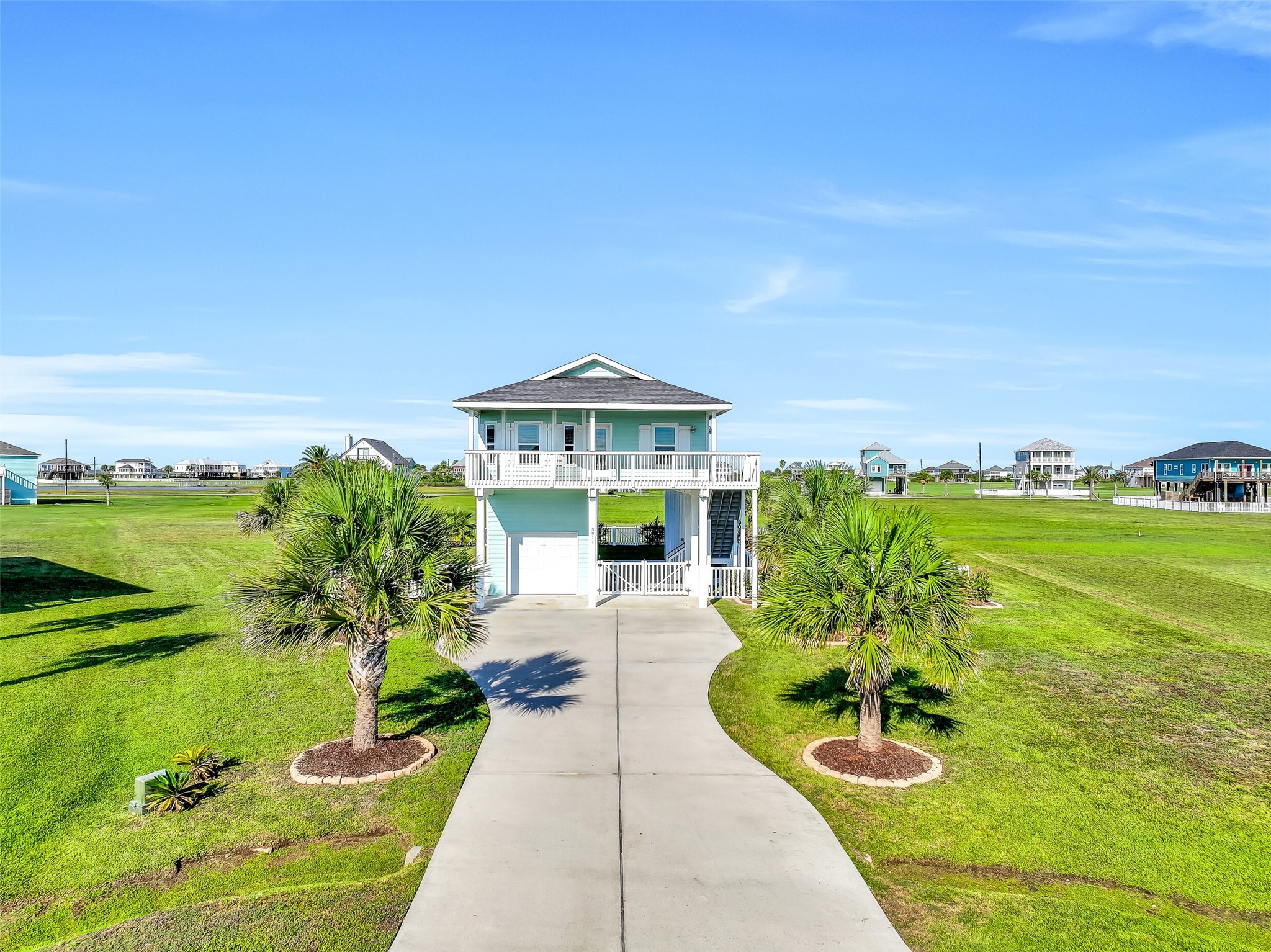 Situated on a spacious lot, this home offers water views from multiple decks, a one-car garage, and a double-wide driveway with plenty of parking.