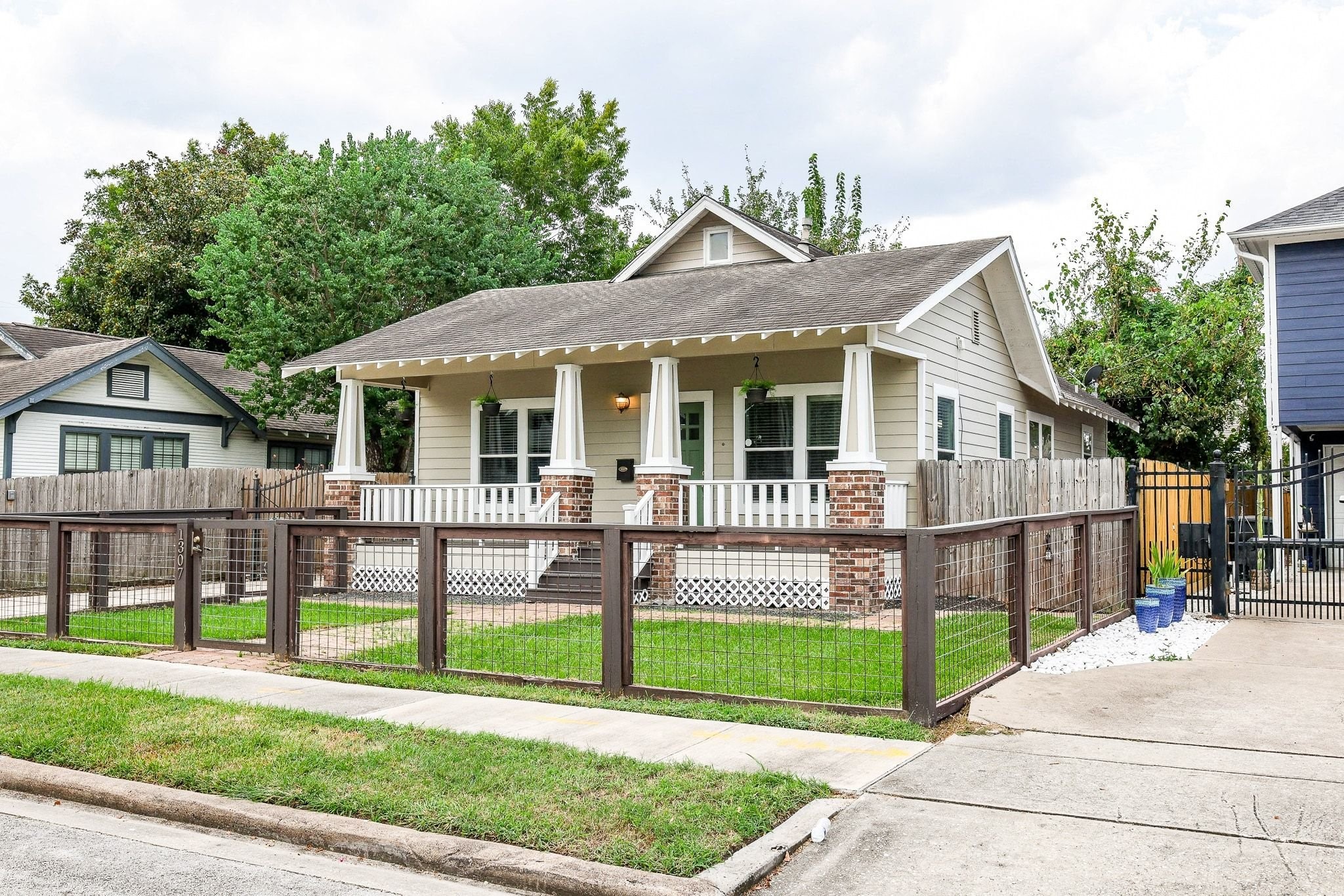 Charming single-story home featuring a welcoming front porch, brick accents, and a neutral color palette throughout. Charming single-story home featuring a welcoming front porch, brick accents, and a neutral color palette throughout.