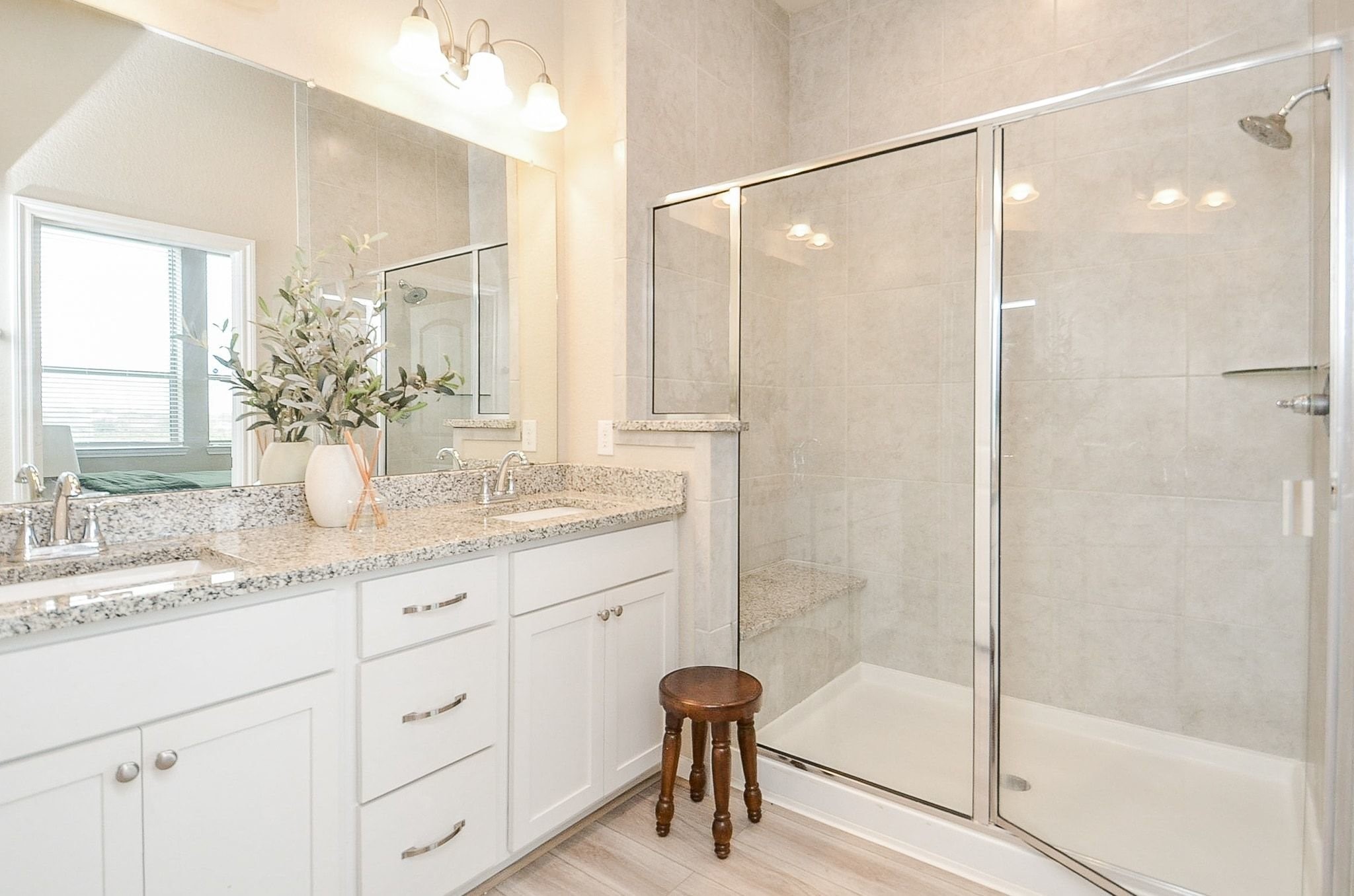 Spacious primary bedroom with double sinks
