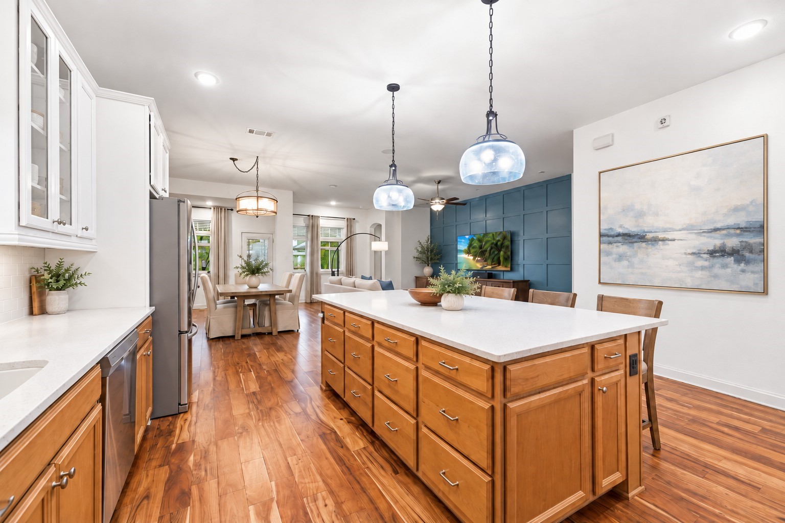 Cabinets of all shapes and sizes all around the kitchen and the island.Virtually Staged