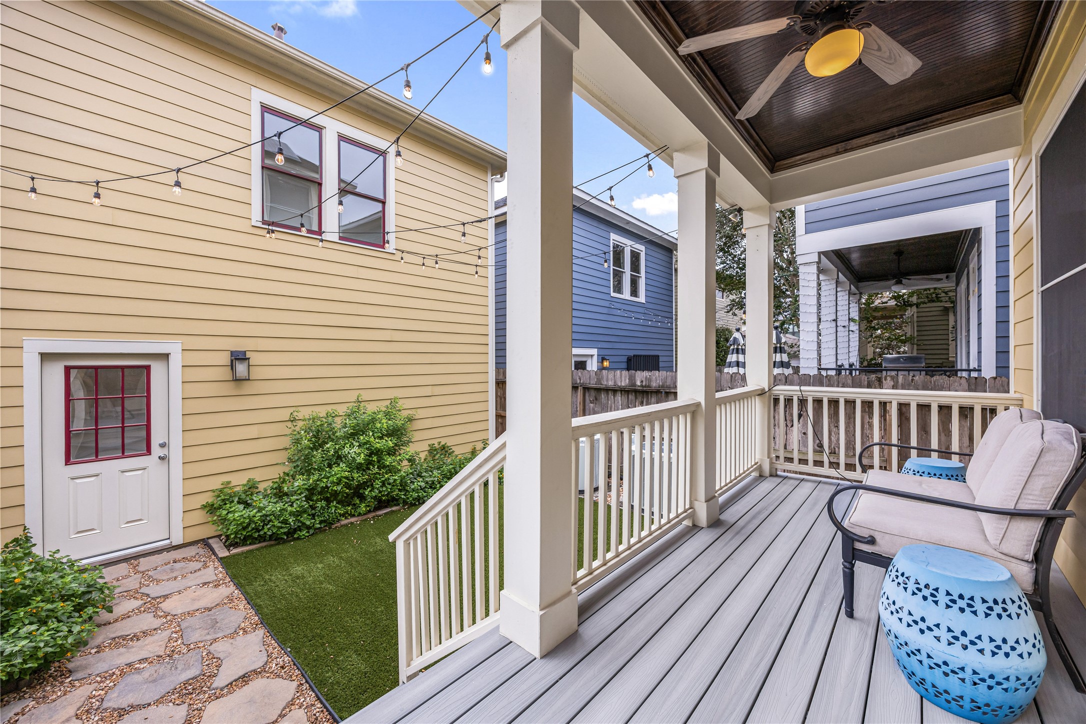 Covered back porch with TREX decking provides a comfortable place to relax or entertain overlooking the private backyard.