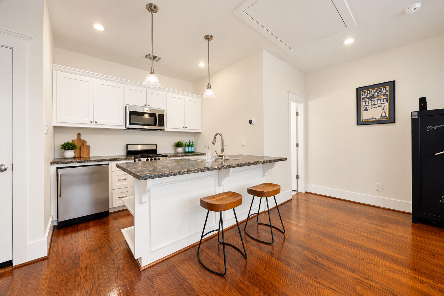 Detached 456 SF garage apartment features a full kitchen, full bathroom & flexible living space for guests, work or extended stays.