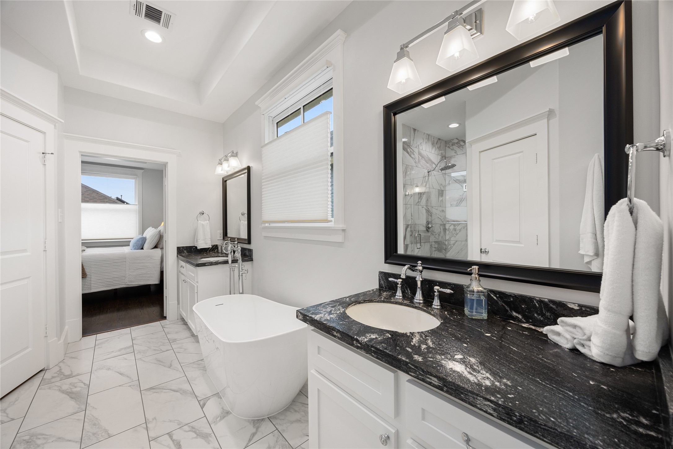 The 2024 renovation included an updated soaking tub, shower, tile flooring & plumbing fixtures.