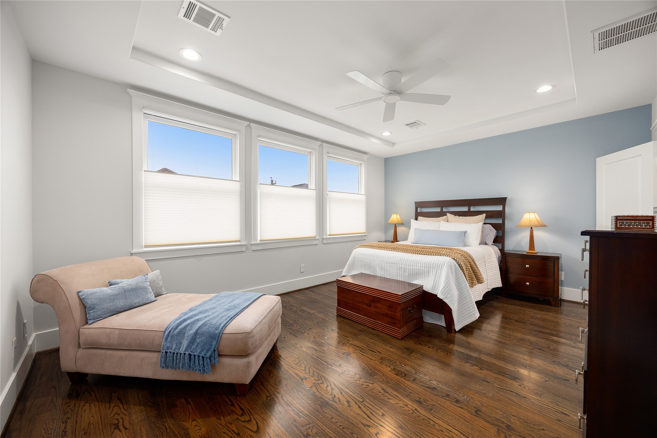 Spacious 2nd-floor primary suite features hardwood floors, abundant natural light & room for a sitting area.