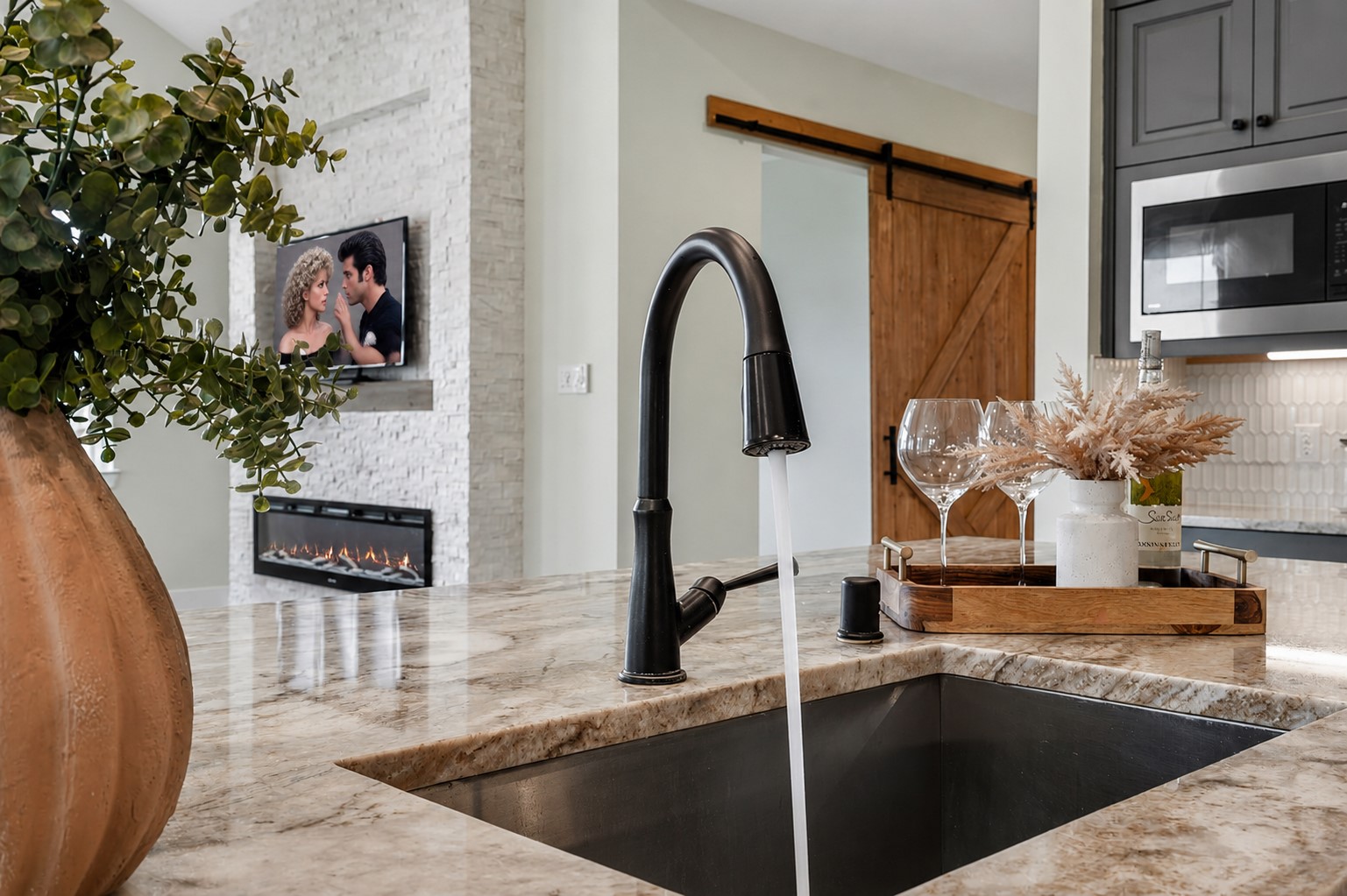 The Kitchen is simply remarkable and is as functional as it is stylish. Here, preparing dinner for the family, entertaining guests or simply doing dishes is made more enjoyable by the soothing ambiance and function of the space.