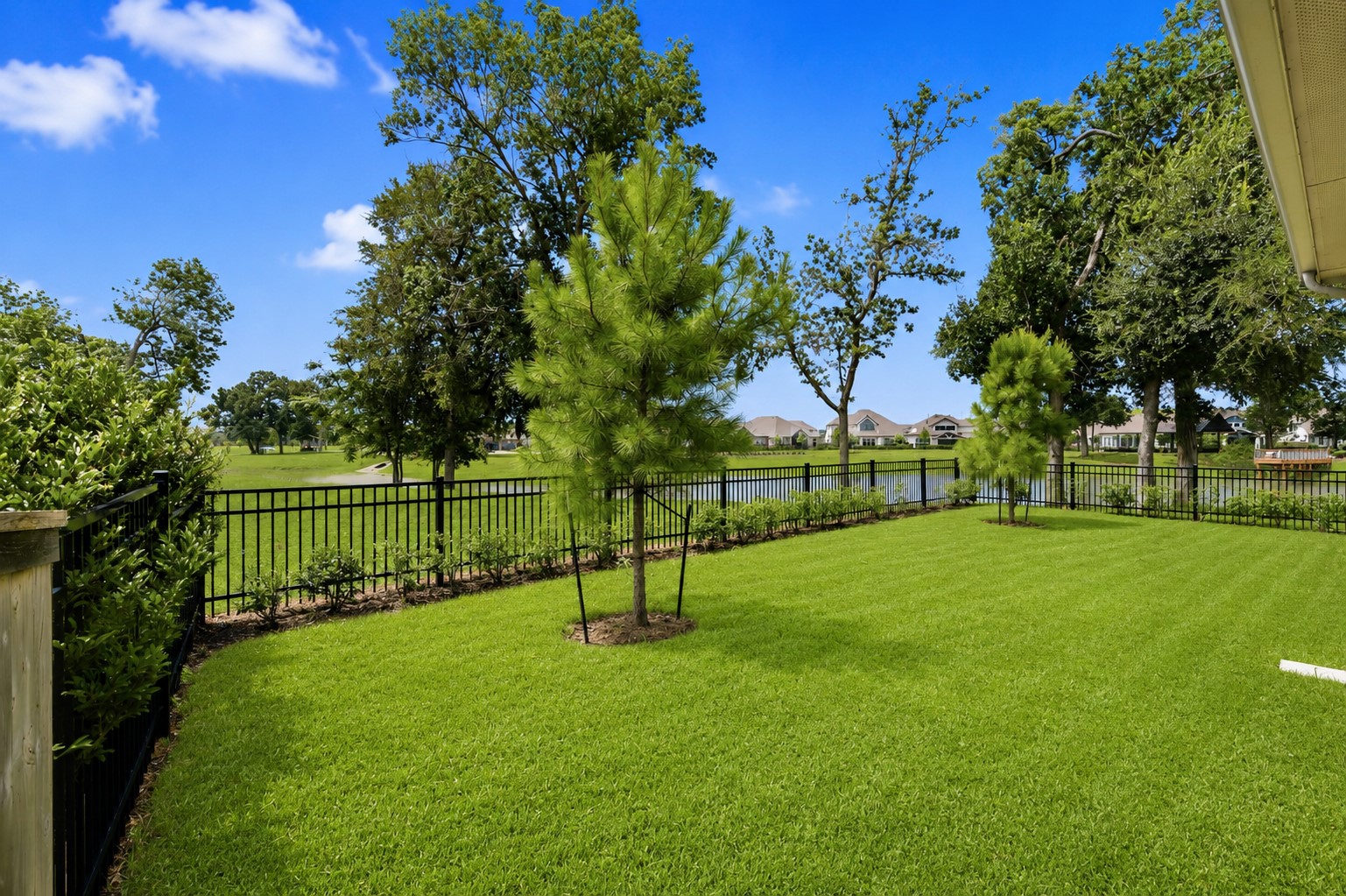 There are not many backyards like this! It is grand in size and style and feels more secure. It is fully fenced in wrought iron and a hedge that wraps the entire fence line. There is plenty of space for kids to play a game of touch or catch. A whole-yard sprinkler system helps keep the lawn and gardens lush, green, and maintained year-round.
