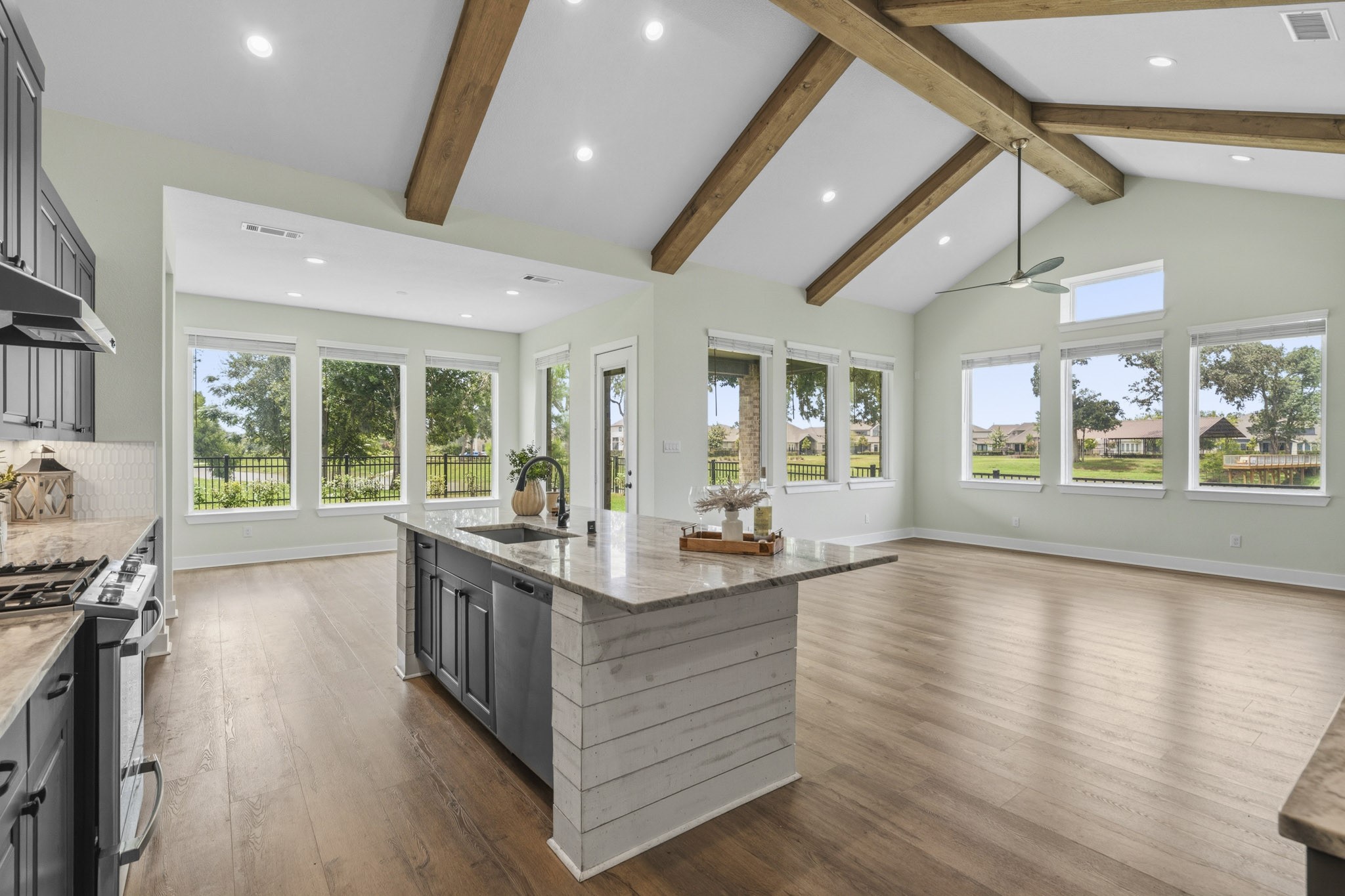 This picture is why you would want to buy this home! And, why you will not find anywhere else in Fulshear Lakes with these stunning 180-degree panorama views of lush landscaping, framed by wrought iron fencing and dramatic views of natural Sheffield Lake that is enhanced by mature trees.