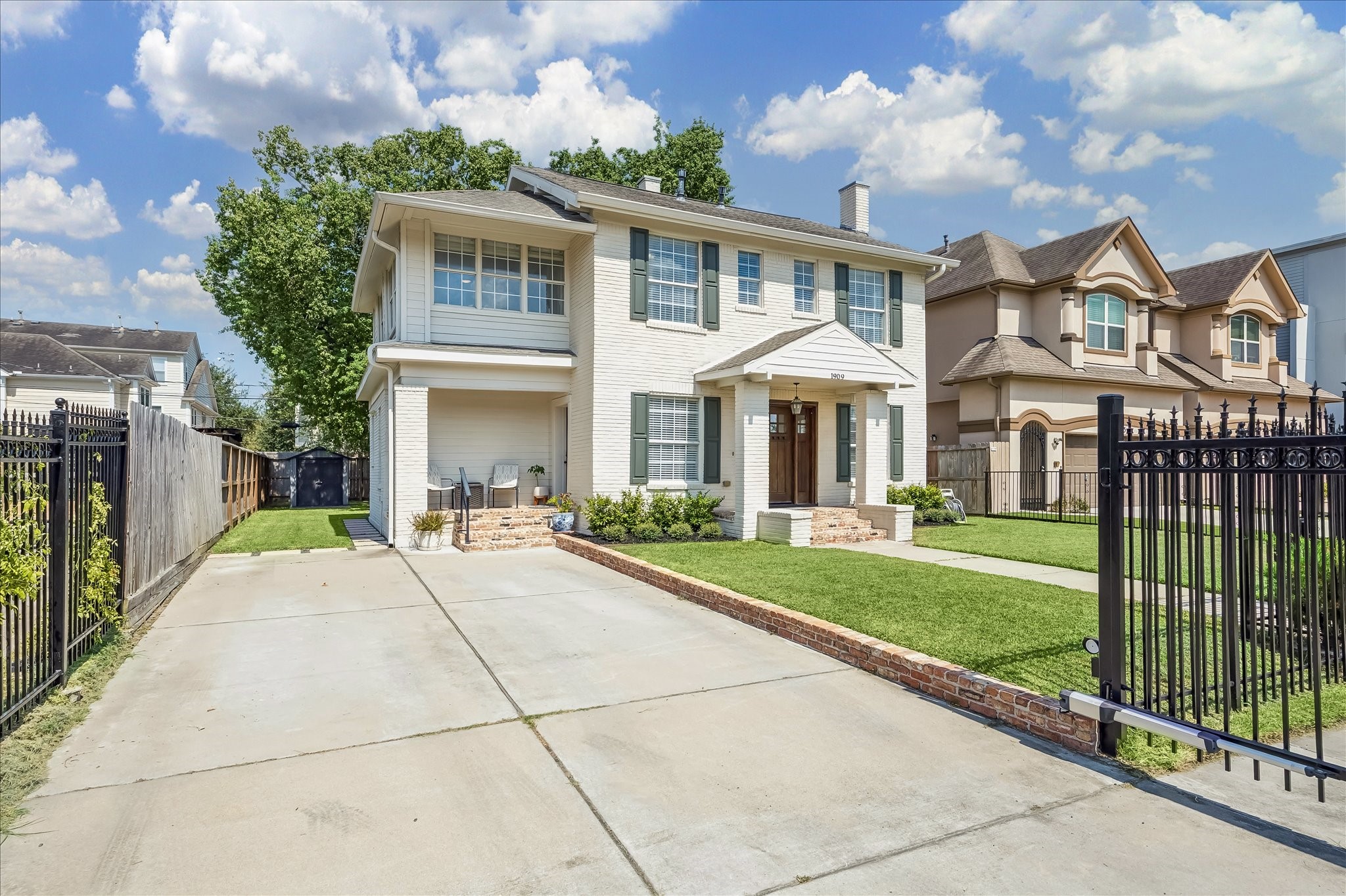 Long driveway poured in 2019 runs alongside the home to the gated entry, which was installed in 2020.