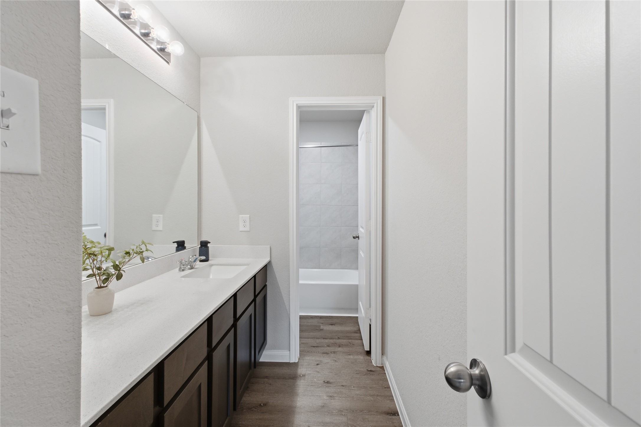 Bathroom 2. Upstairs, vanity area, combo shower/tub