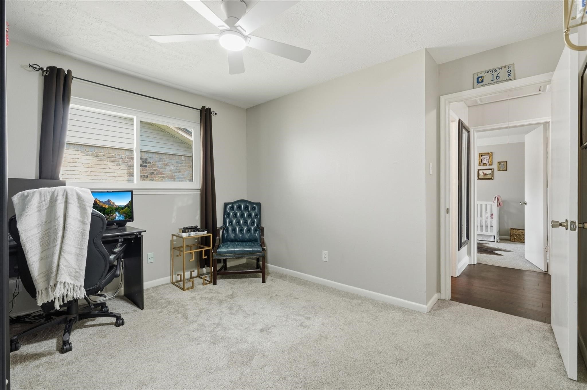 Bedroom number 3 of the 3 secondary bedrooms. Prior to converting to an additional office space, this room easily fit a queen bed!