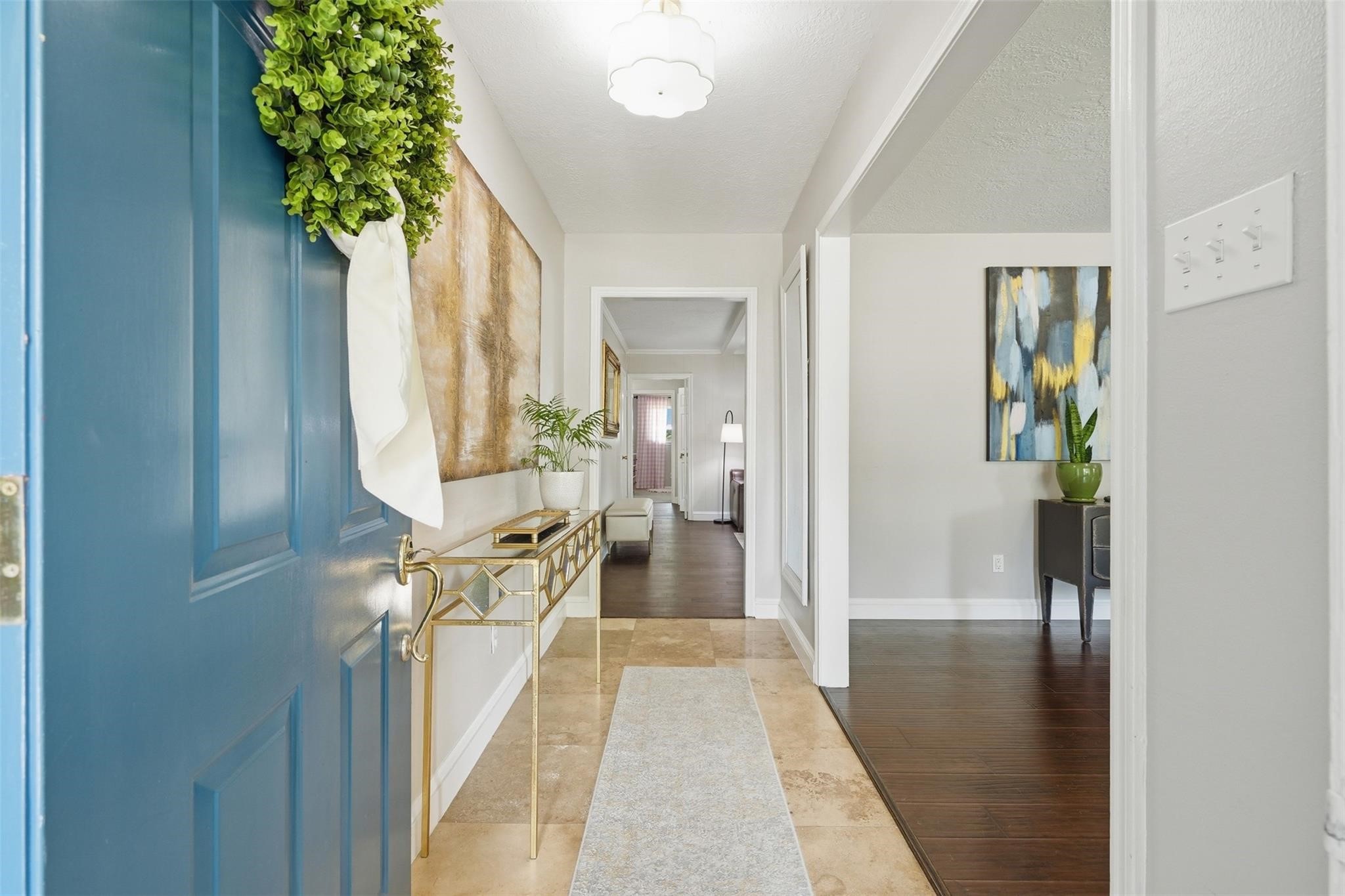 Upon entering you are greeted with light and bright neutral paint, tile flooring and a welcoming foyer