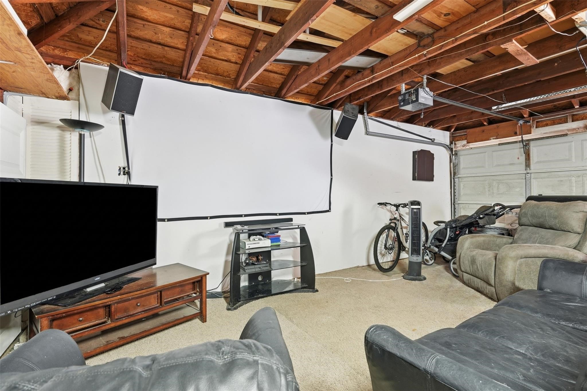 The 2 car garage features a working AC unit!