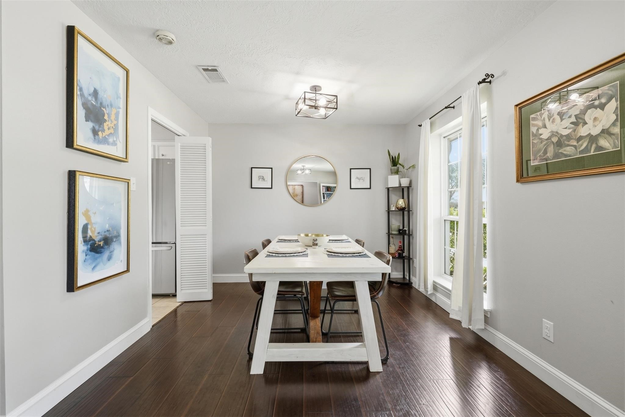 Perfectly positioned just off the kitchen, the formal dining room creates a functional space for hosting dinner parties, holiday celebrations, and special occasions while maintaining an open, connected feel.