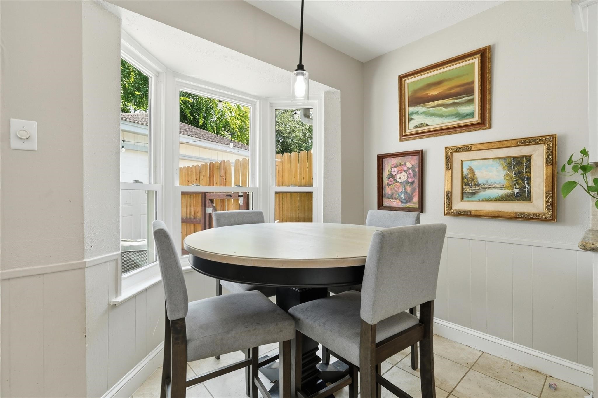 Kitchenette can be found just off the main living space and kitchen. New light fixture installed (2026), and back fence (2021)