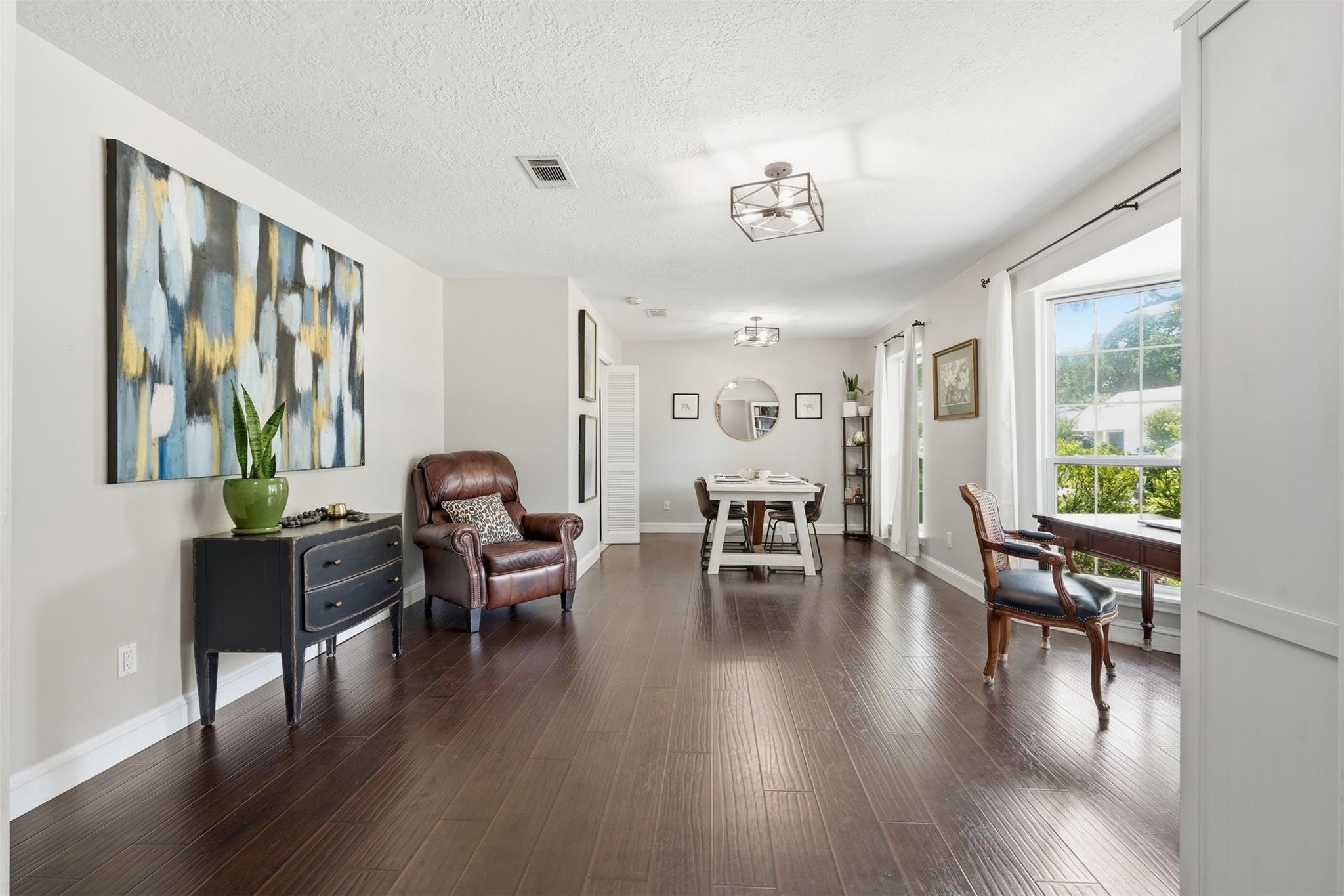 Whether you envision an elegant formal dining room for hosting holiday gatherings, a sophisticated sitting room for entertaining guests, or a spacious playroom or flex space, this room is designed to adapt to your lifestyle. Large double-pane windows fill the space with natural light while enhancing energy efficiency and year-round comfort