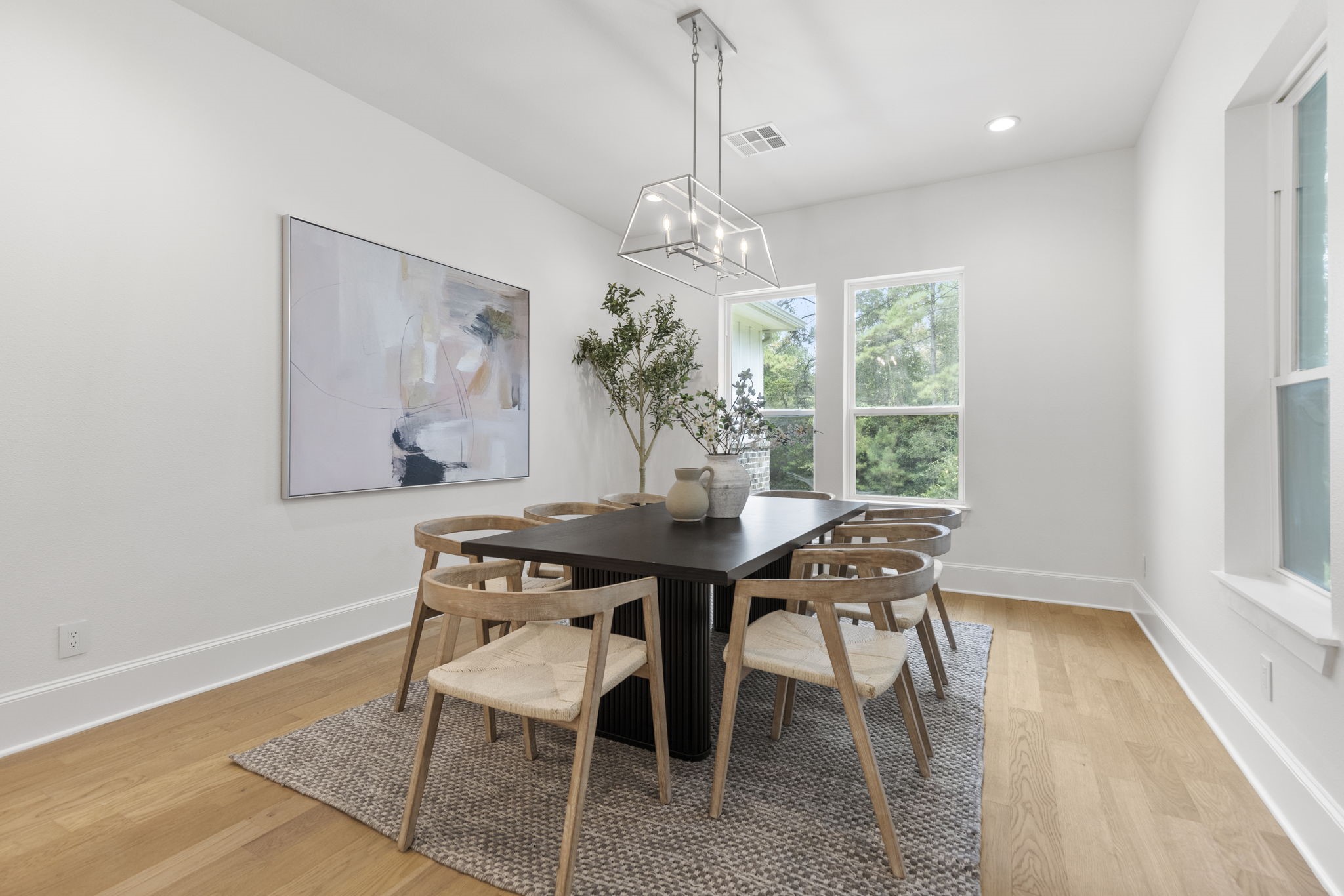 This dining room is open and inviting, providing ample space for large family gatherings and seamless entertaining.