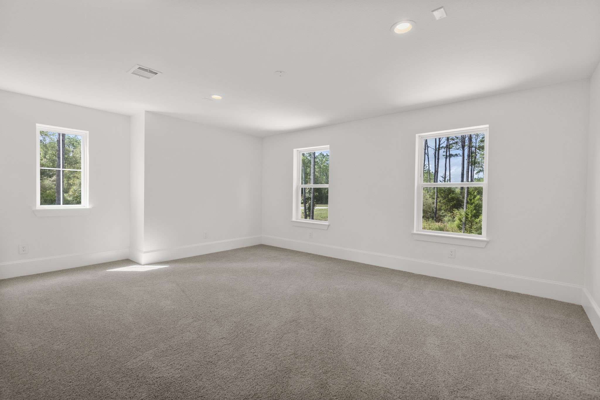 Spacious upstairs game room perfect for entertaining and versatile living.