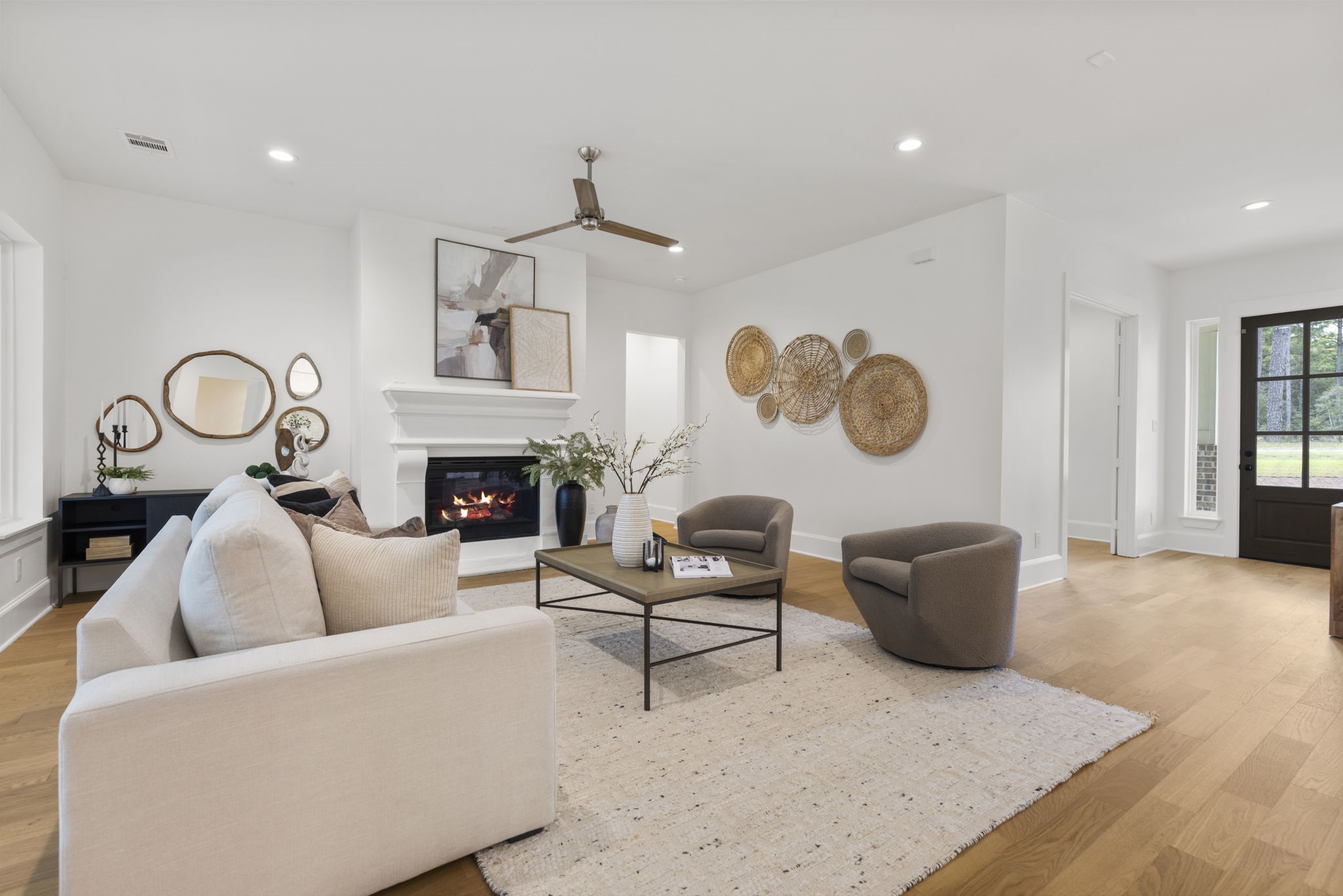 This upscale, inviting living area features a relaxing ambiance centered around a fireplace with an elegant mantle. To the left, a recessed niche provides the perfect space-saving nook to showcase a gorgeous piece of furniture or decor. This upscale, inviting living area features a relaxing ambiance centered around a fireplace with an elegant mantle. To the left, a recessed niche provides the perfect space-saving nook to showcase a gorgeous piece of furniture or decor.