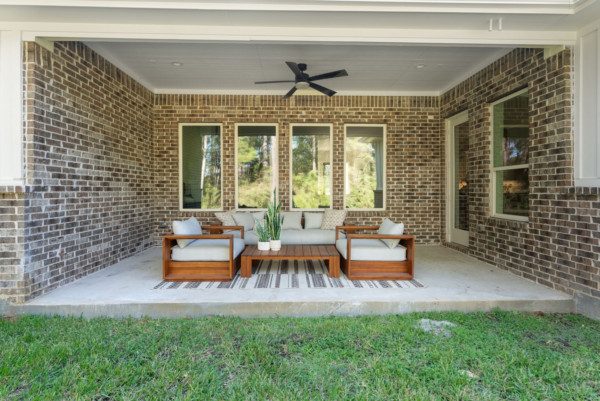 The covered lanai offers ample space for comfortable lounge furniture, creating the perfect setting for relaxing or enjoying conversation with friends and family.