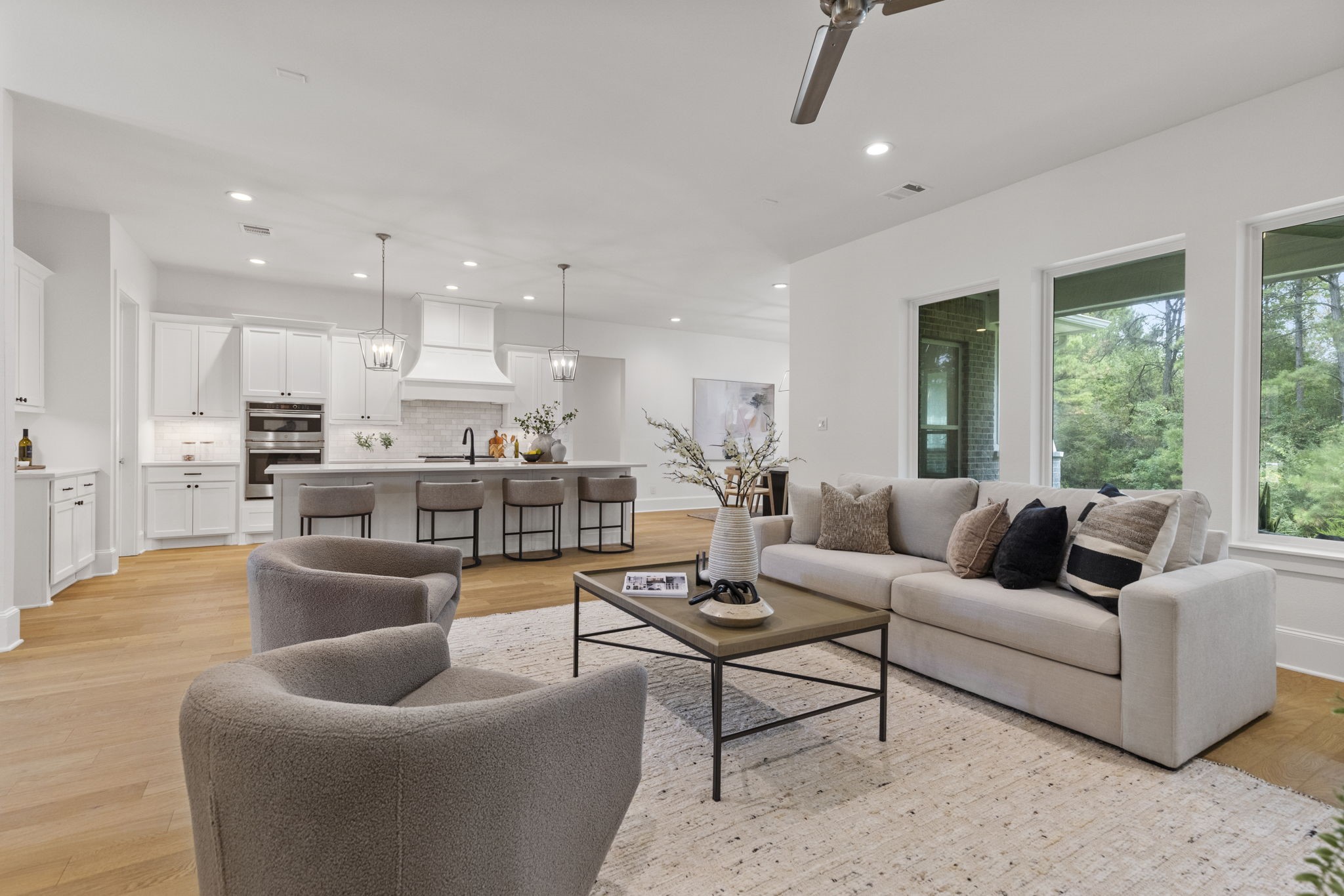 The family room features an inviting, open-concept layout that flows seamlessly into the kitchen, creating an ideal space for both entertaining and everyday living. The family room features an inviting, open-concept layout that flows seamlessly into the kitchen, creating an ideal space for both entertaining and everyday living.