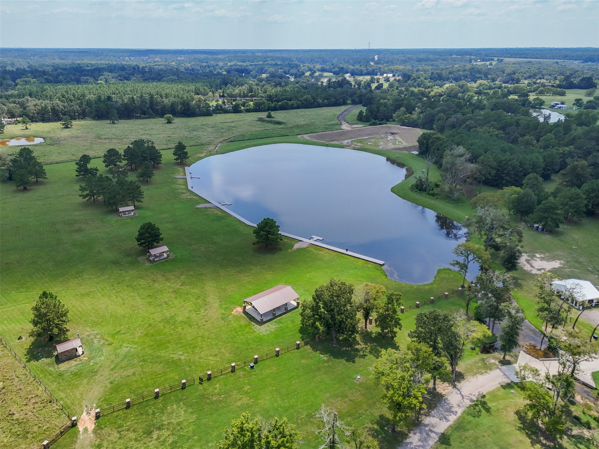 This community park area offers expansive space for recreation and features lakefront docks perfect for fishing and relaxation.