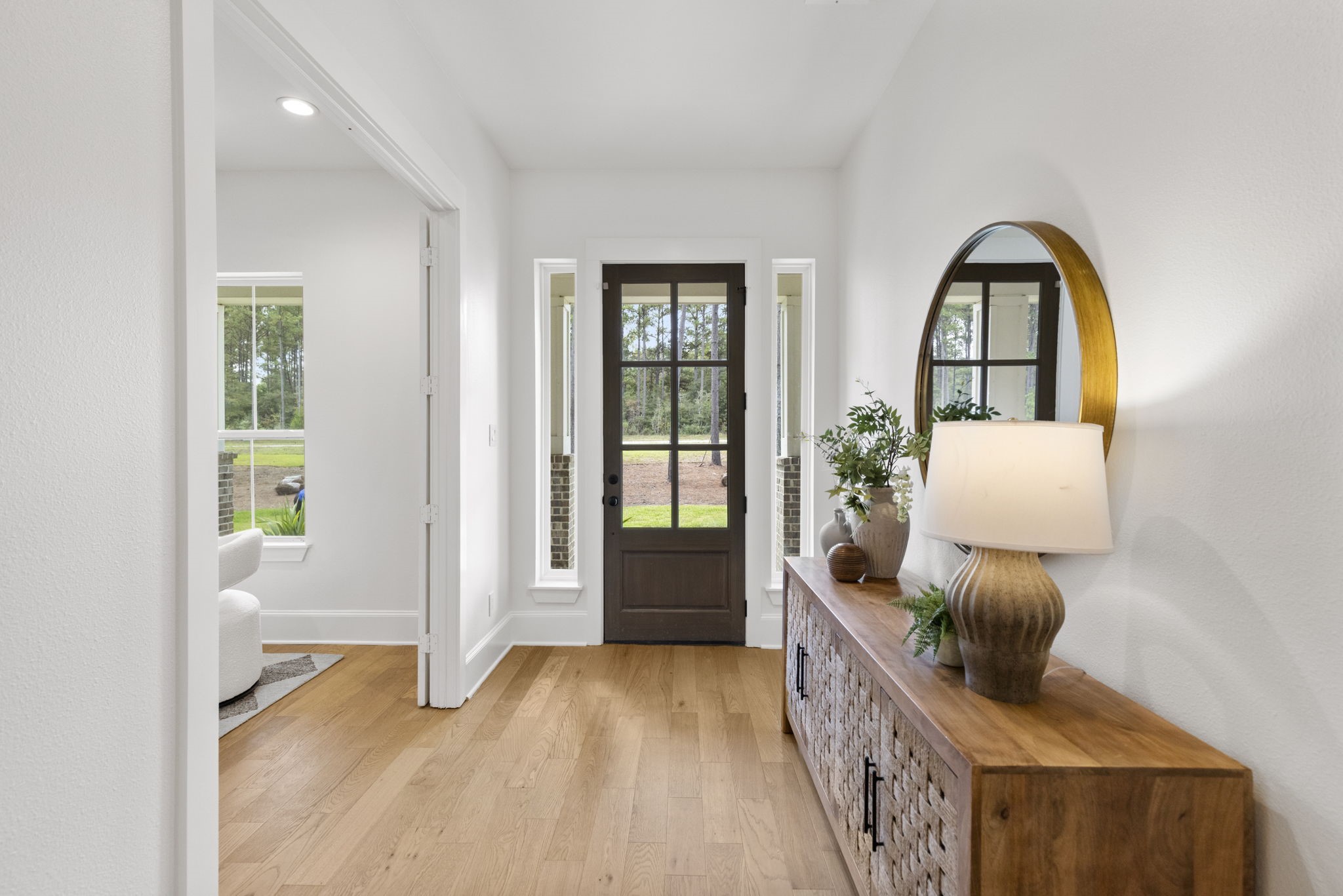 This gorgeous entry features sophisticated engineered wood flooring complemented by crisp, designer-white walls for an inviting and elegant first impression. This gorgeous entry features sophisticated engineered wood flooring complemented by crisp, designer-white walls for an inviting and elegant first impression.