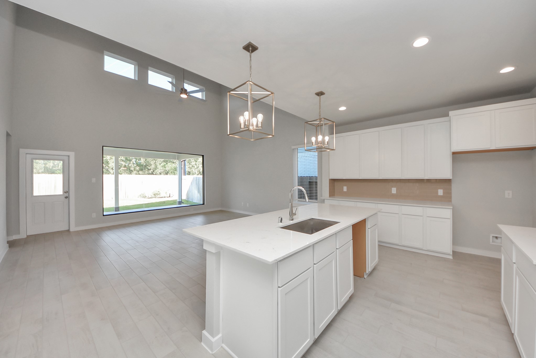 All of this overlooks your expansive family room, creating a perfect space for culinary delights and family gatherings.