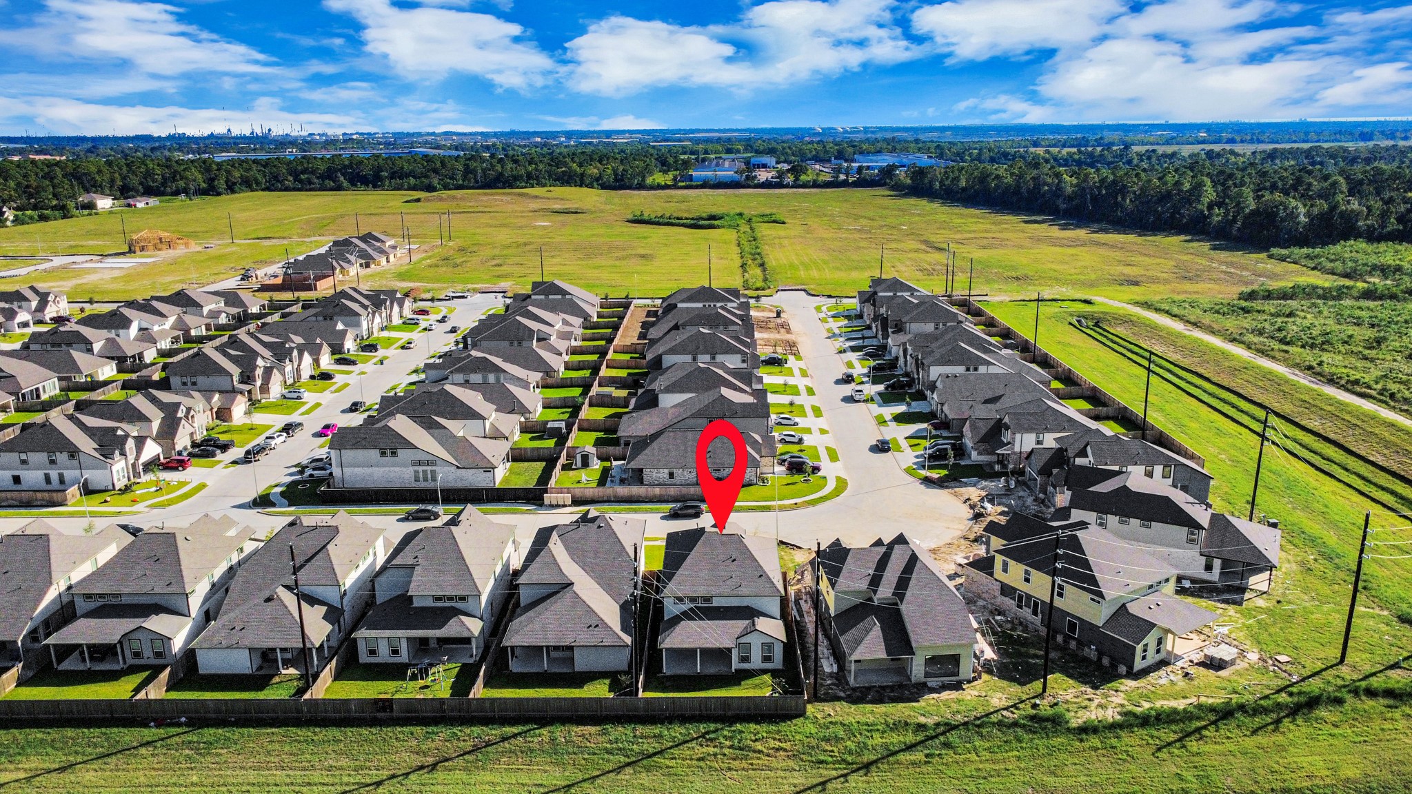 An aerial view of a spacious subdivision lot, highlighting a well-maintained yard and a fully fenced perimeter, offering both privacy and expansive outdoor space. An aerial view of a spacious subdivision lot, highlighting a well-maintained yard and a fully fenced perimeter, offering both privacy and expansive outdoor space.