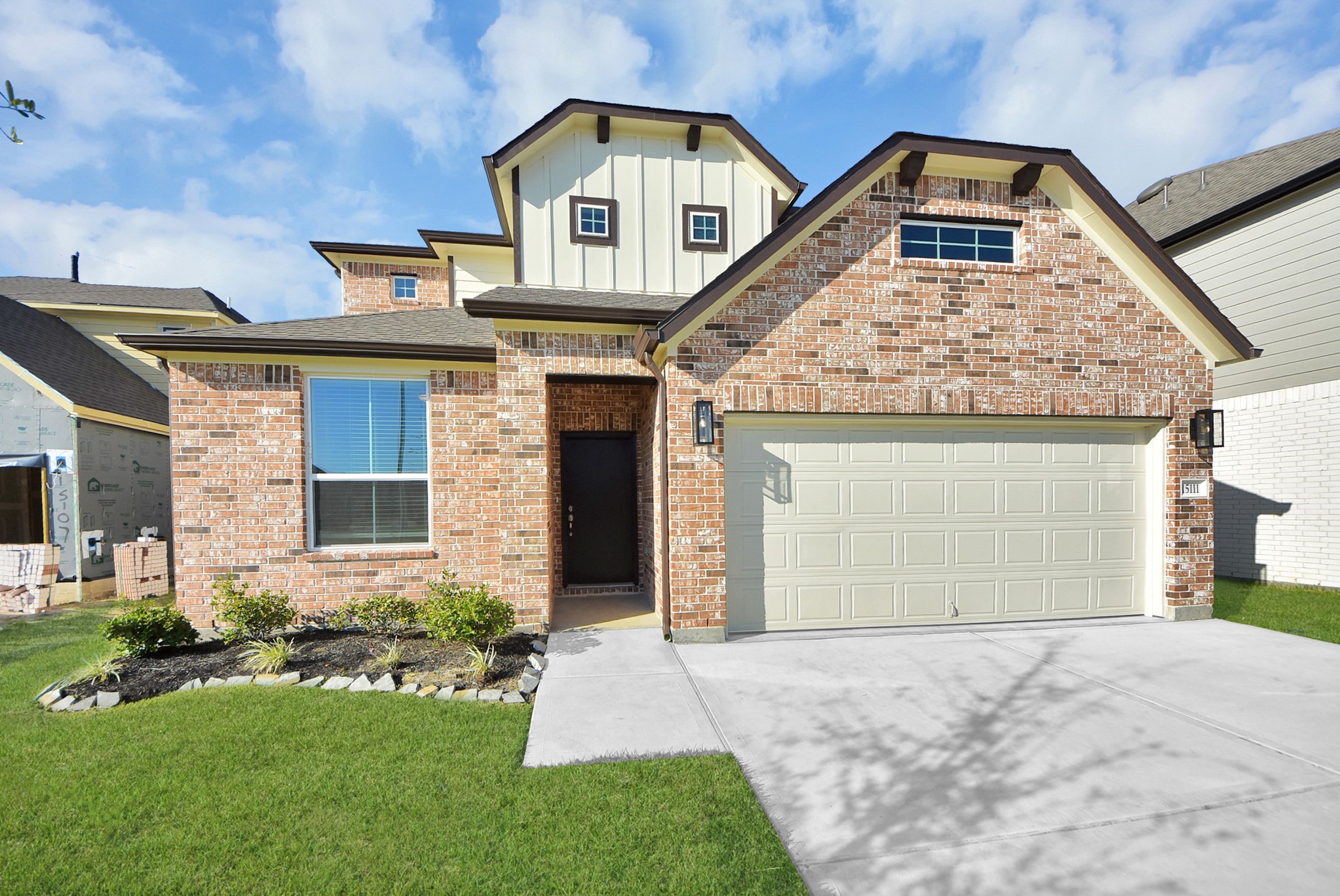 The residence features a practical 2-car garage complemented by a generous driveway, ensuring abundant space for parking needs. The residence features a practical 2-car garage complemented by a generous driveway, ensuring abundant space for parking needs.