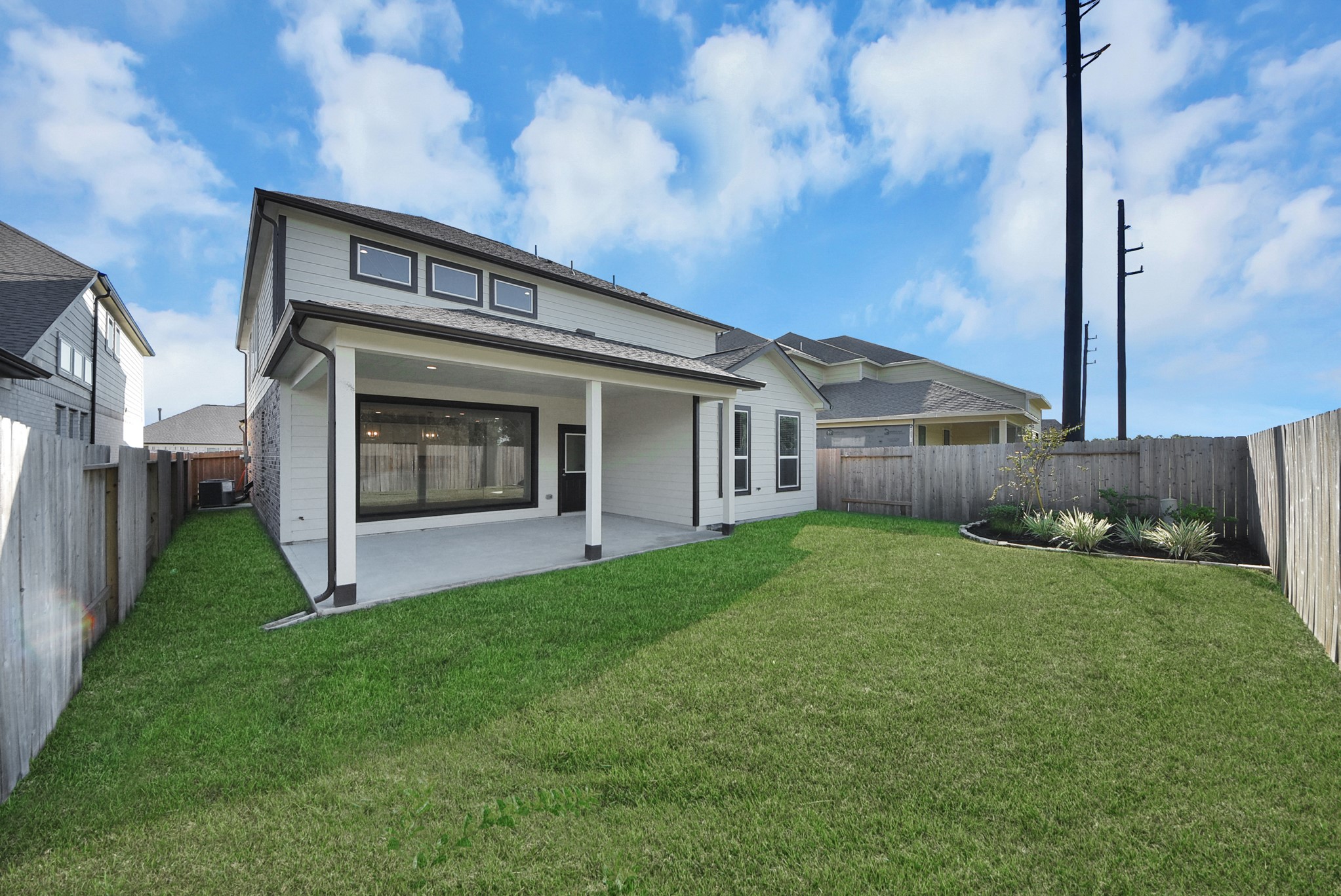 Come and see this spacious backyard with its beautiful covered patio. There is plenty of room for the kids to play and adults to relax. Perfect for your outdoor living space, patio furniture, bbq pit, and so much more. The possibilities are endless!