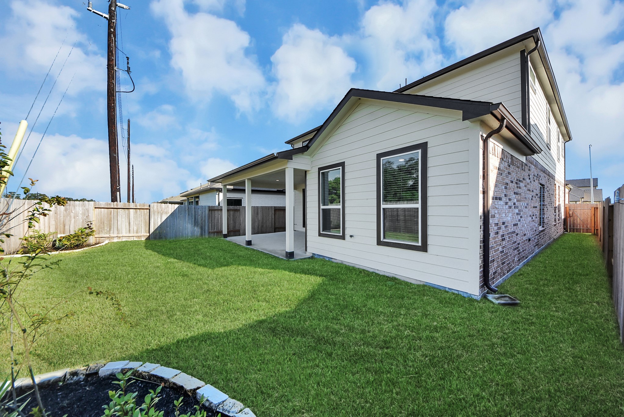 Come and see this spacious backyard with its beautiful covered patio. There is plenty of room for the kids to play and adults to relax. Perfect for your outdoor living space, patio furniture, bbq pit, and so much more. The possibilities are endless!