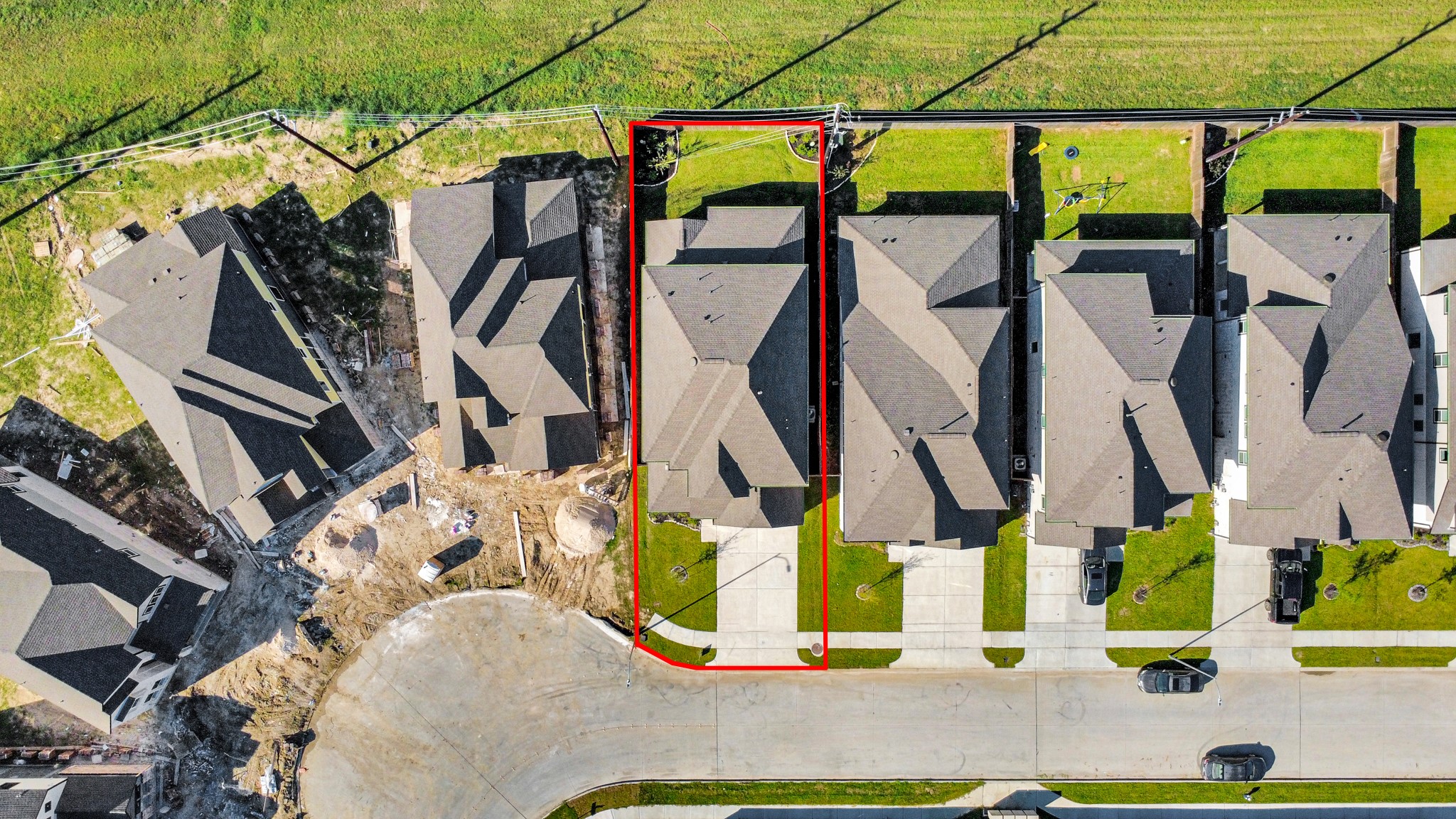 An aerial view of a spacious subdivision lot, highlighting a well-maintained yard and a fully fenced perimeter, offering both privacy and expansive outdoor space. An aerial view of a spacious subdivision lot, highlighting a well-maintained yard and a fully fenced perimeter, offering both privacy and expansive outdoor space.