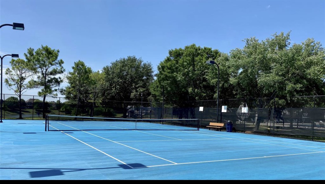 Shadow Creek Ranch residents enjoy access to community tennis courts, providing a great setting for recreational play & friendly competition! The fenced courts feature a bright blue playing surface, surrounding lighting & convenient seating, adding to the impressive selection of neighborhood recreational amenities.