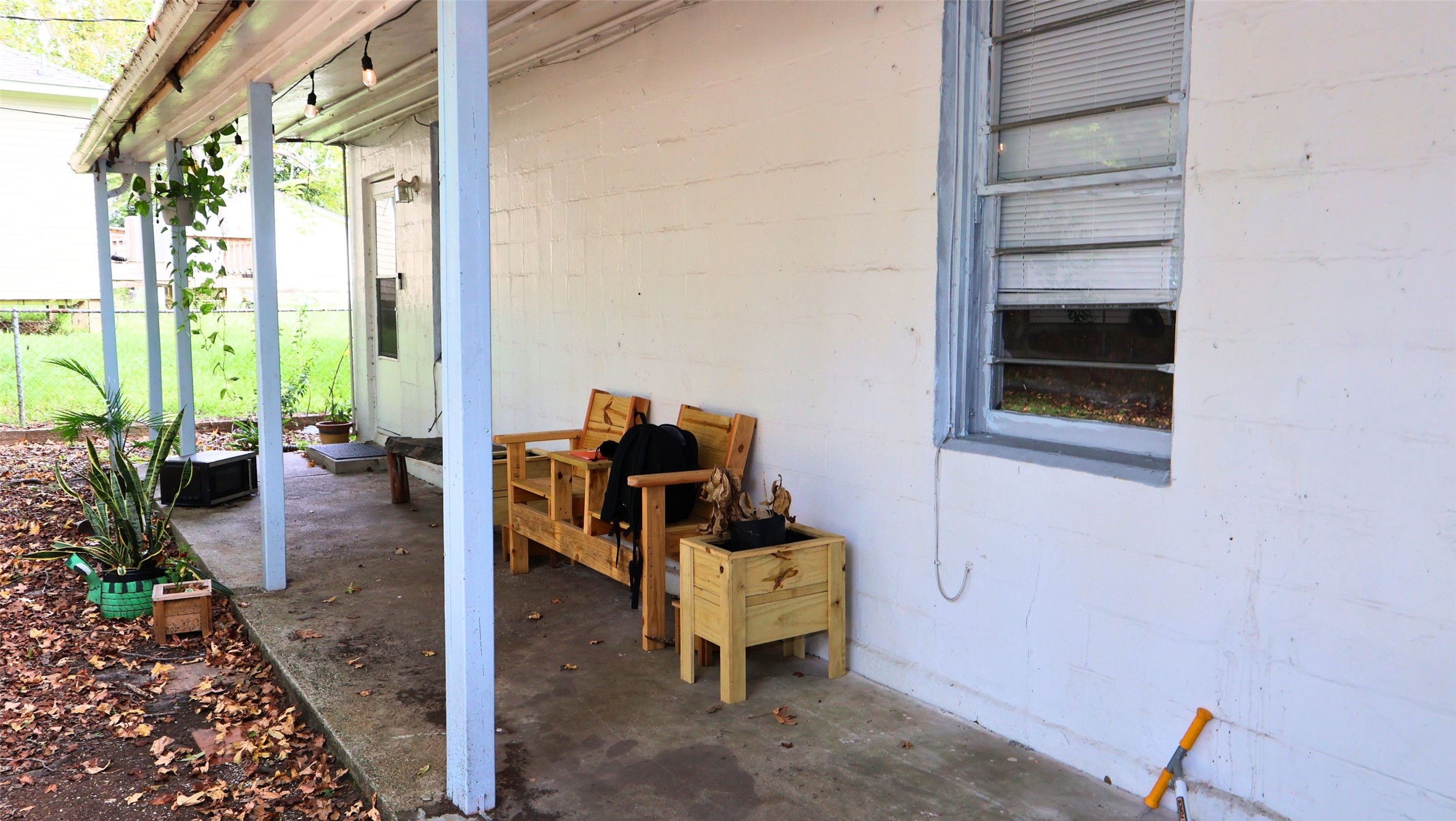 Charming covered patio with cozy seating, perfect for relaxing and enjoying the outdoors. Charming covered patio with cozy seating, perfect for relaxing and enjoying the outdoors.