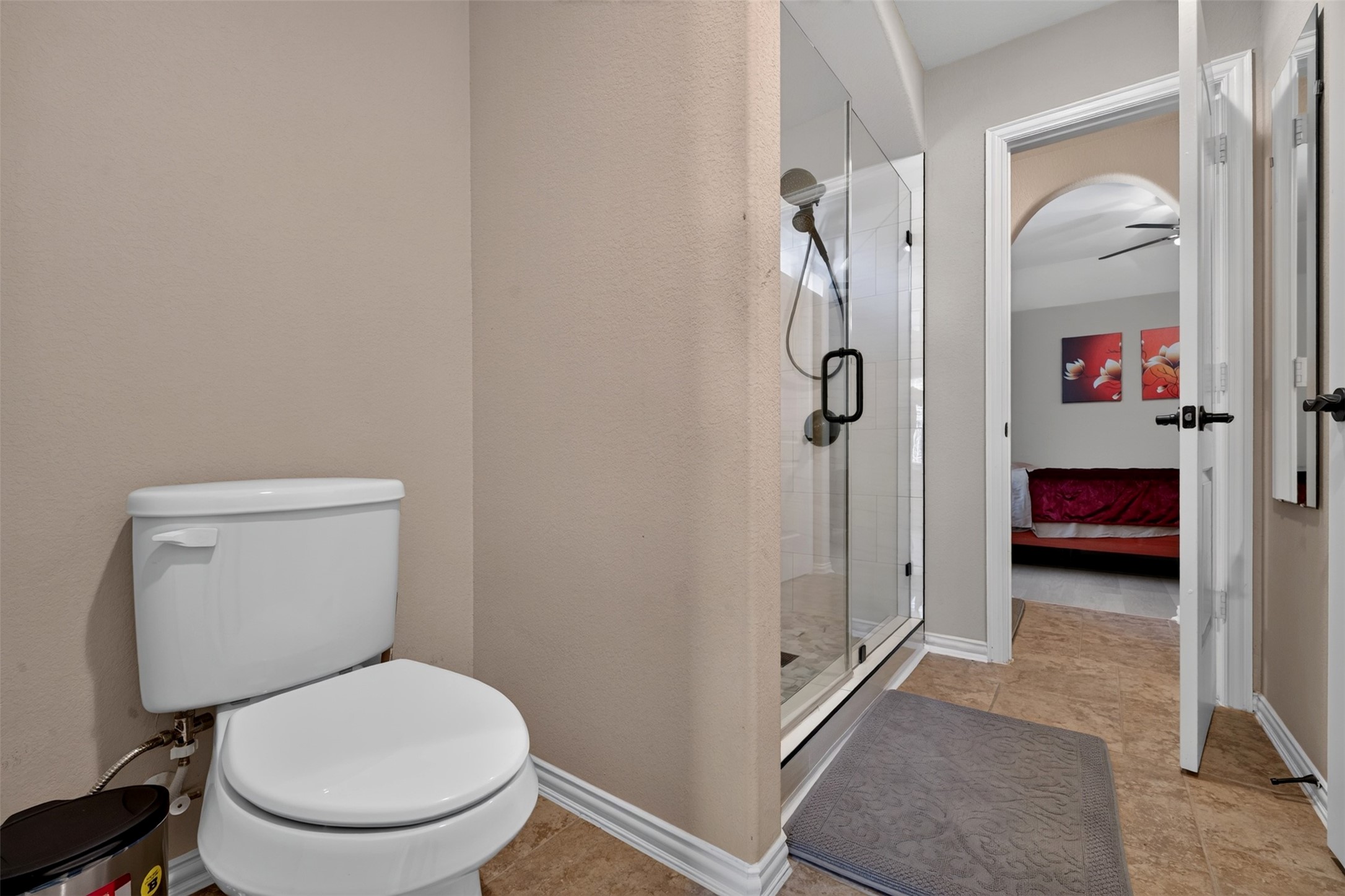 This bathroom features a separate water closet and a walk-in shower, creating a functional layout for daily routines.