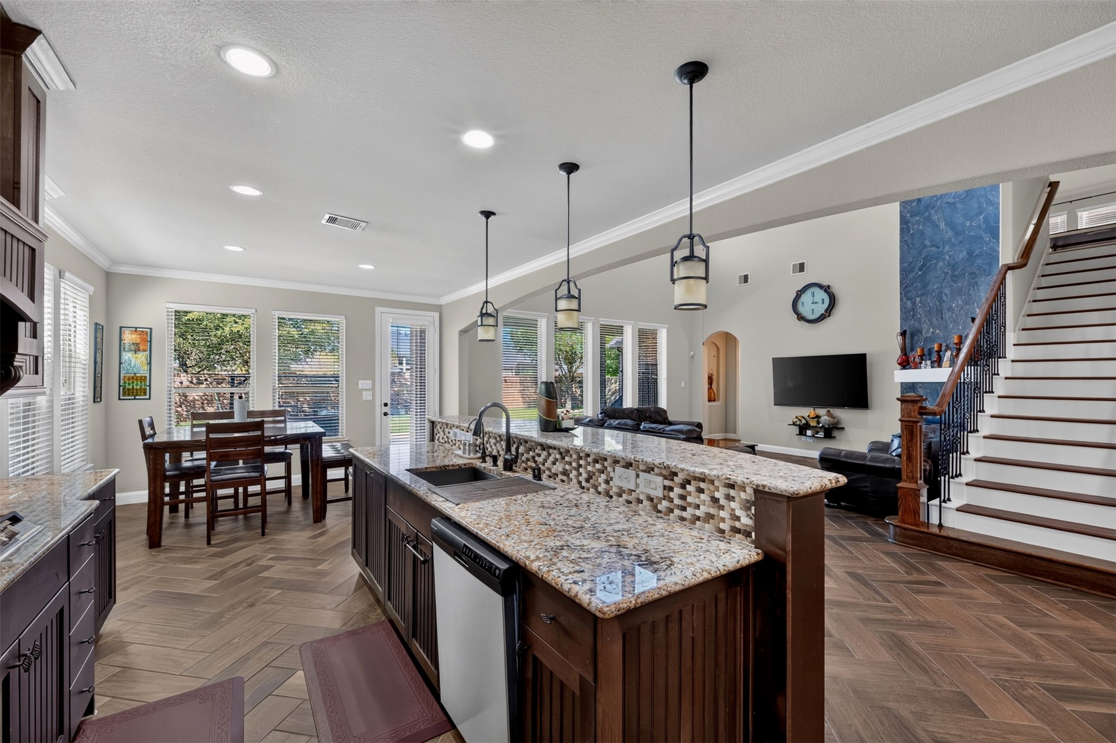 The open layout keeps the kitchen connected to the heart of the home. Whether preparing dinner, helping with homework, or entertaining friends, you can stay part of the conversation while enjoying the spacious design.