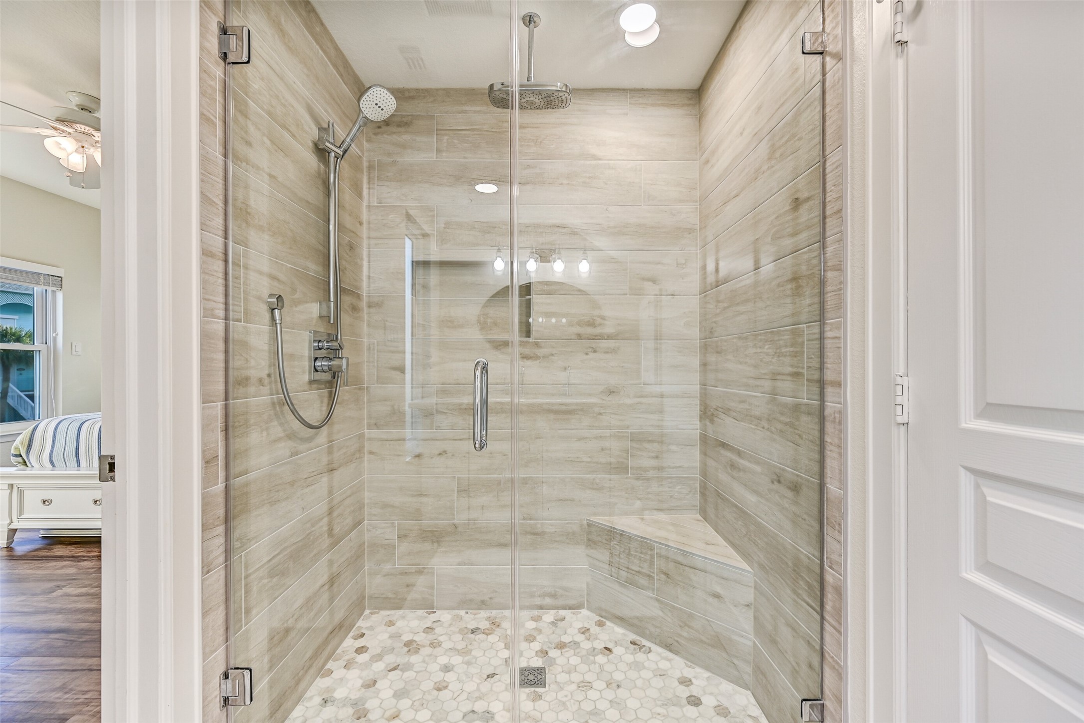Notice the double shower heads and gorgeous tile surrounding in this shower!