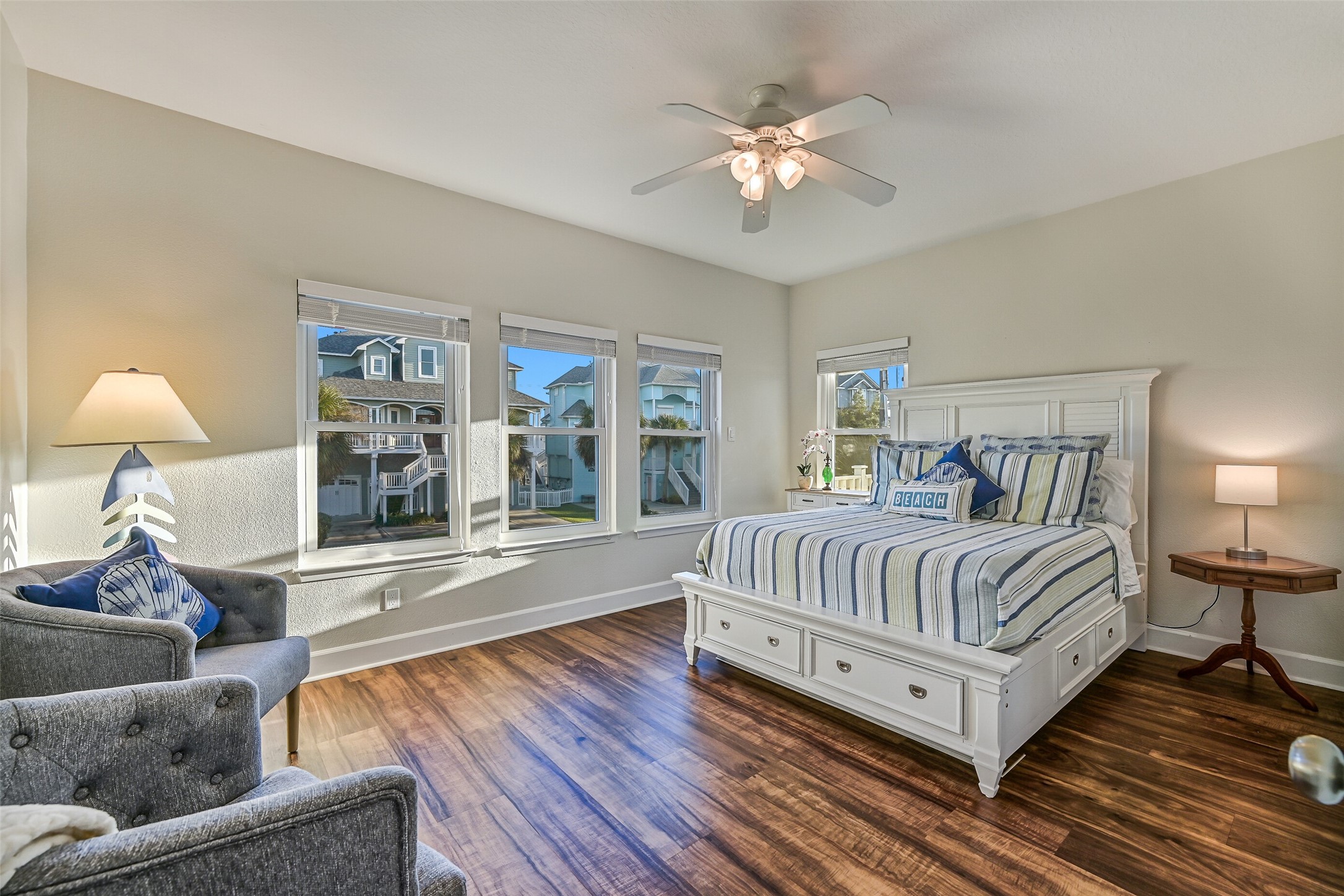 Privately tucked down the hall from the living room, the expansive primary suite features a luxurious en-suite bathroom.
