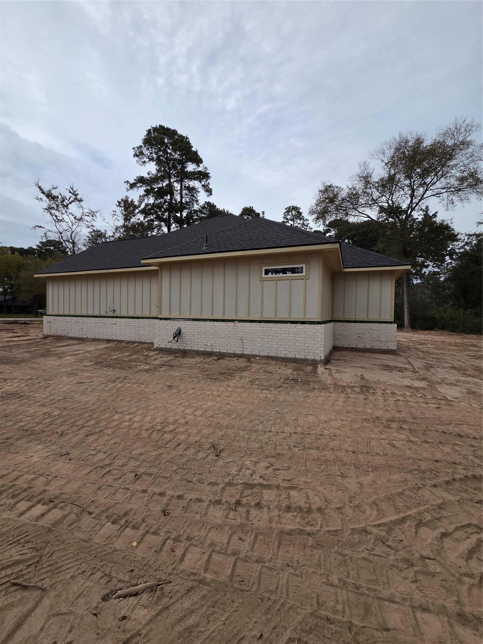 SIDE OF HOME WITH HIGH-QUALITY BRICK AND JAMES HARDI EXTERIOR