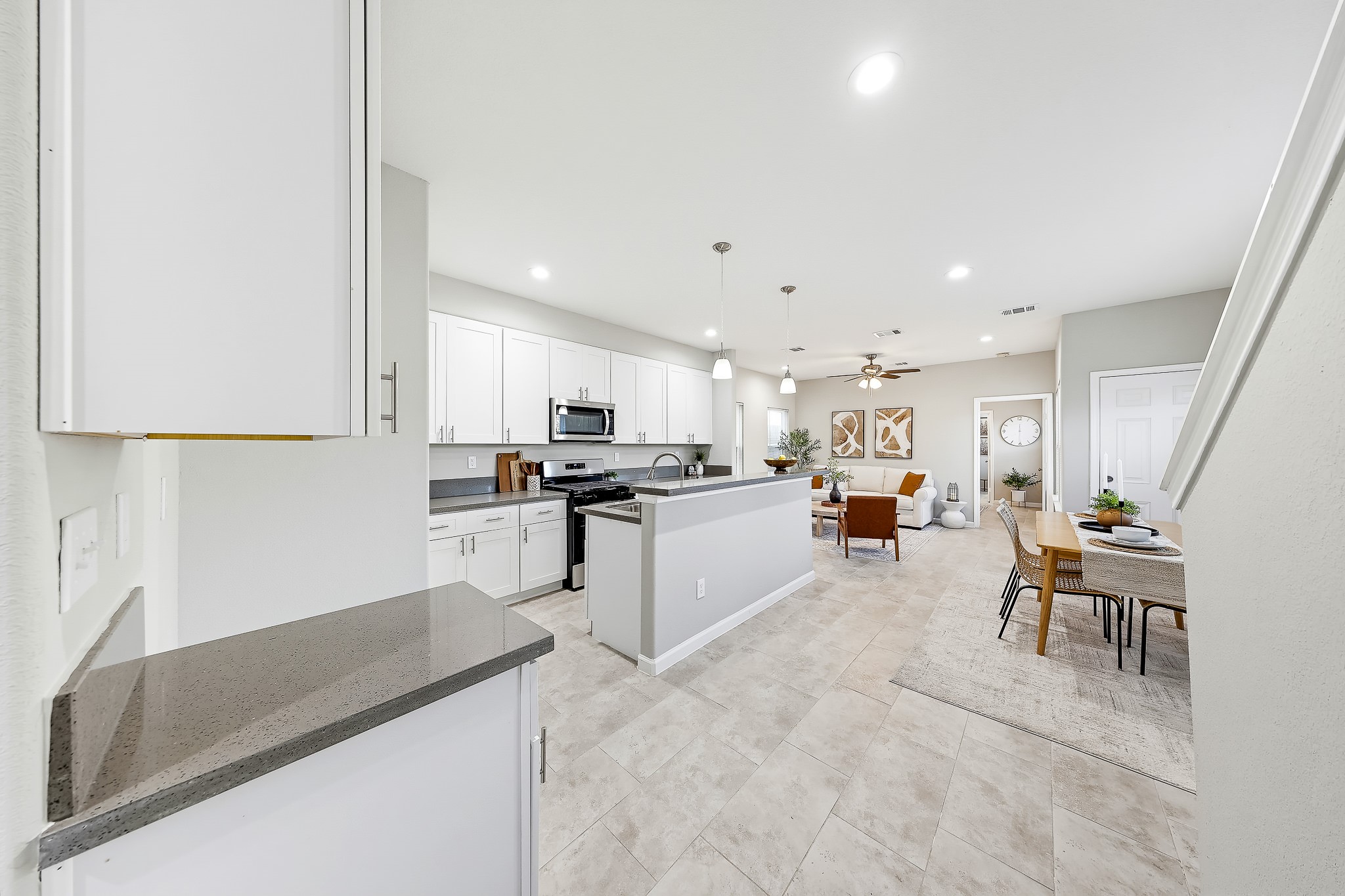 Enjoy a kitchen that opens to the dining and living spaces, keeping conversation flowing. Enjoy a kitchen that opens to the dining and living spaces, keeping conversation flowing.