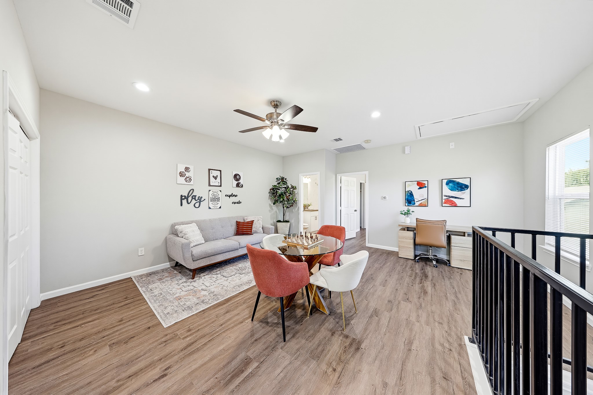 Bring on game nights, this upstairs gathering space has room for fun, relaxation, and a creative corner. Bring on game nights, this upstairs gathering space has room for fun, relaxation, and a creative corner.