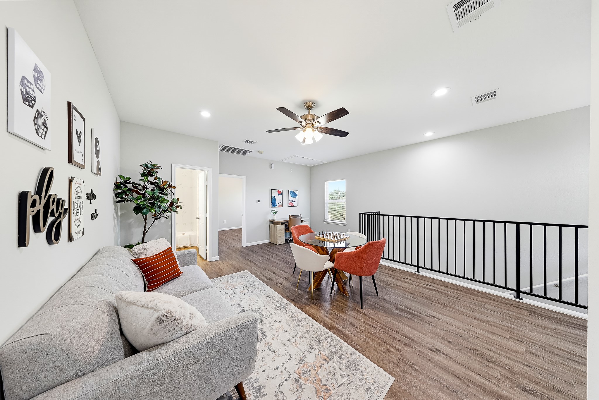 A second living space upstairs lets game nights continue while the downstairs stays ready for relaxing.