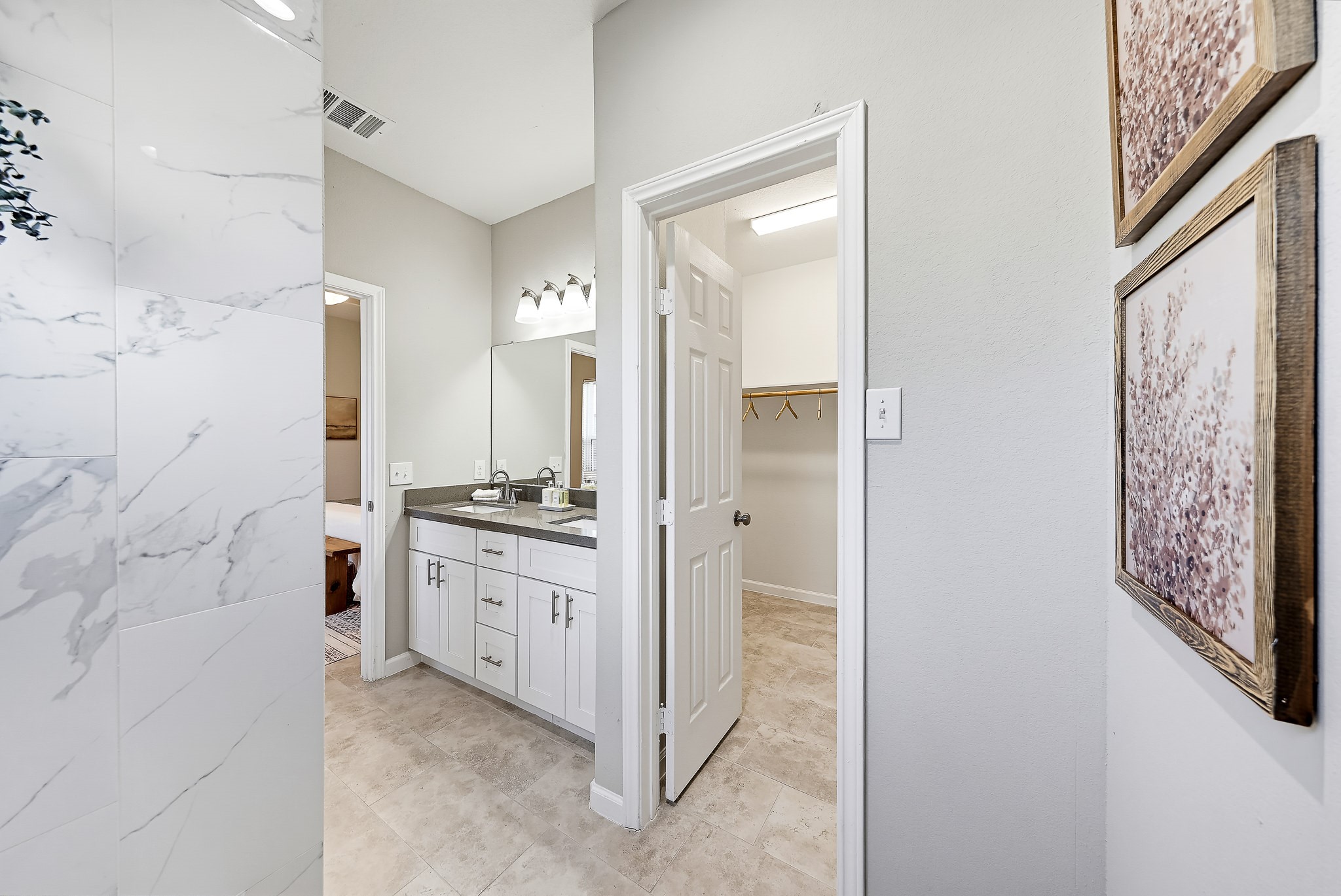 Your primary bathroom brings together a separate shower and a vanity with room for daily essentials.